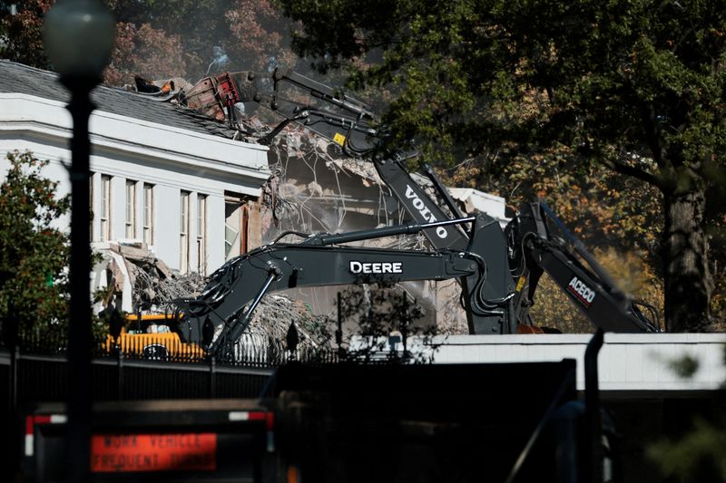 A demolition crew takes apart the facade of the East Wing of the White House, where President Donald Trump's proposed ballroom is being built, in Washington, D.C., Monday.