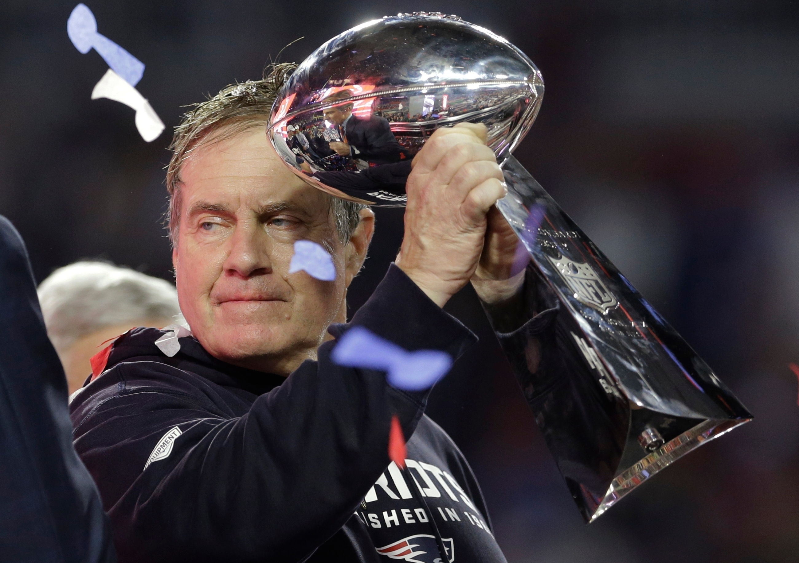 FILE - New England Patriots head coach Bill Belichick holds up the Vince Lombardi Trophy as he celebrates after the Patriots defeated the Seattle Seahawks 28-24 in NFL Super Bowl XLIX football game Sunday, Feb. 1, 2015, in Glendale, Ariz. 
