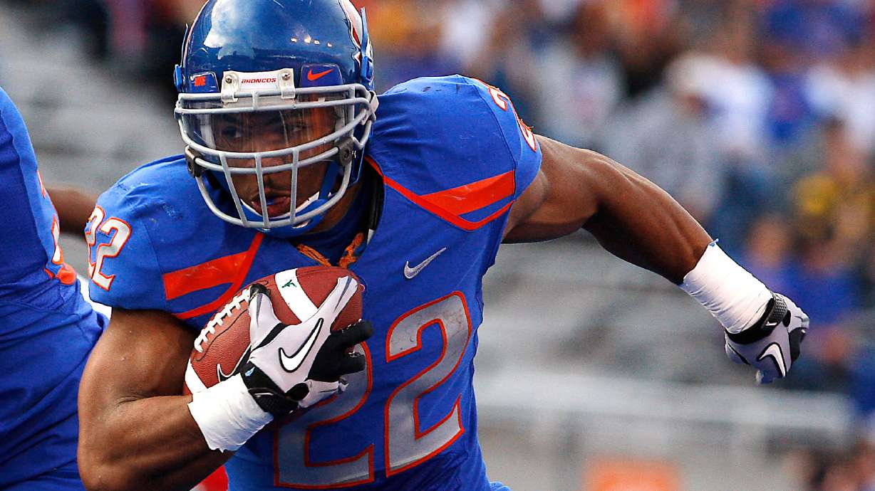 FILE - Boise State's doug Martin runs for a first down during the first half of the NCAA college football game against Toledo, Saturday, Oct. 9, 2010 in Boise, Idaho.