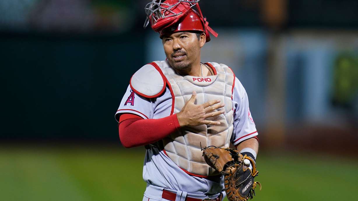 FILE - Los Angeles Angels catcher Kurt Suzuki gestures during the first inning of a baseball game against the Oakland Athletics in Oakland, Calif., Oct. 4, 2022.