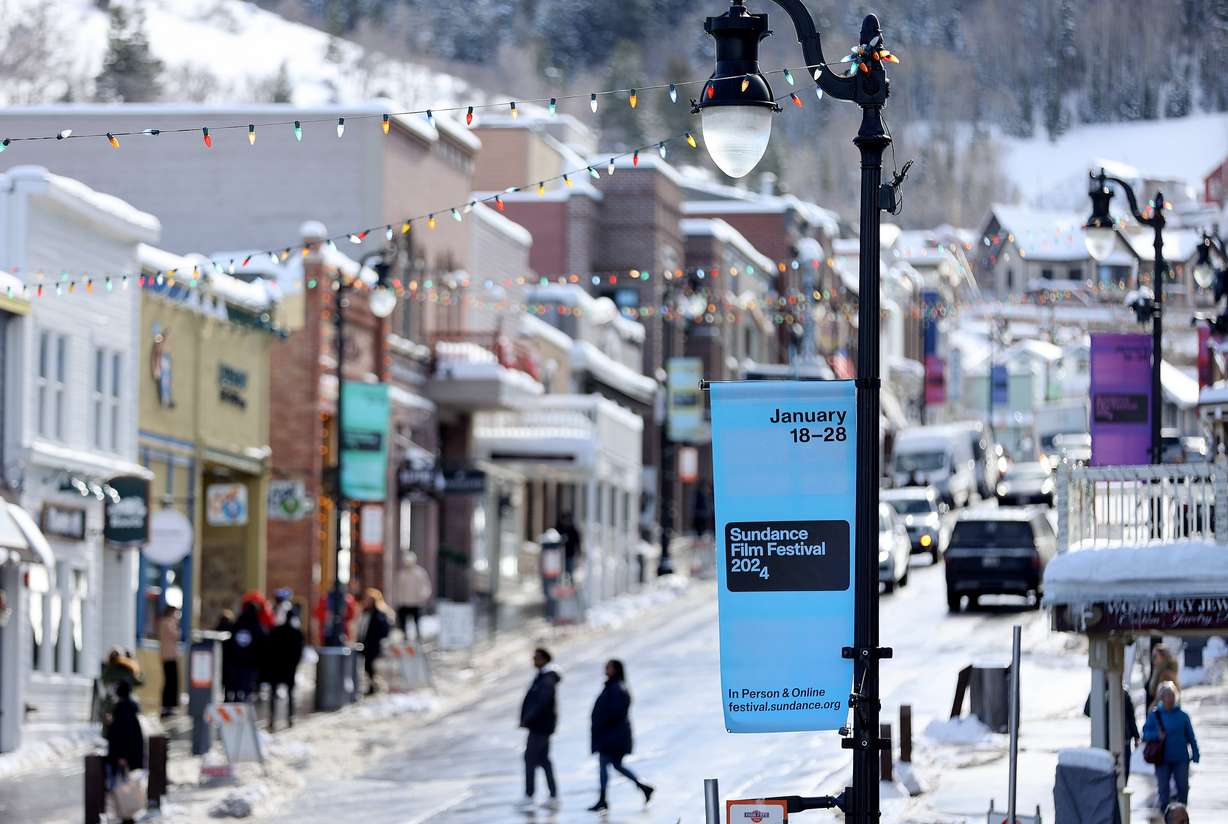 Signs are posted for the 2024 Sundance Film Festival on Main Street in Park City on Jan. 18, 2024.