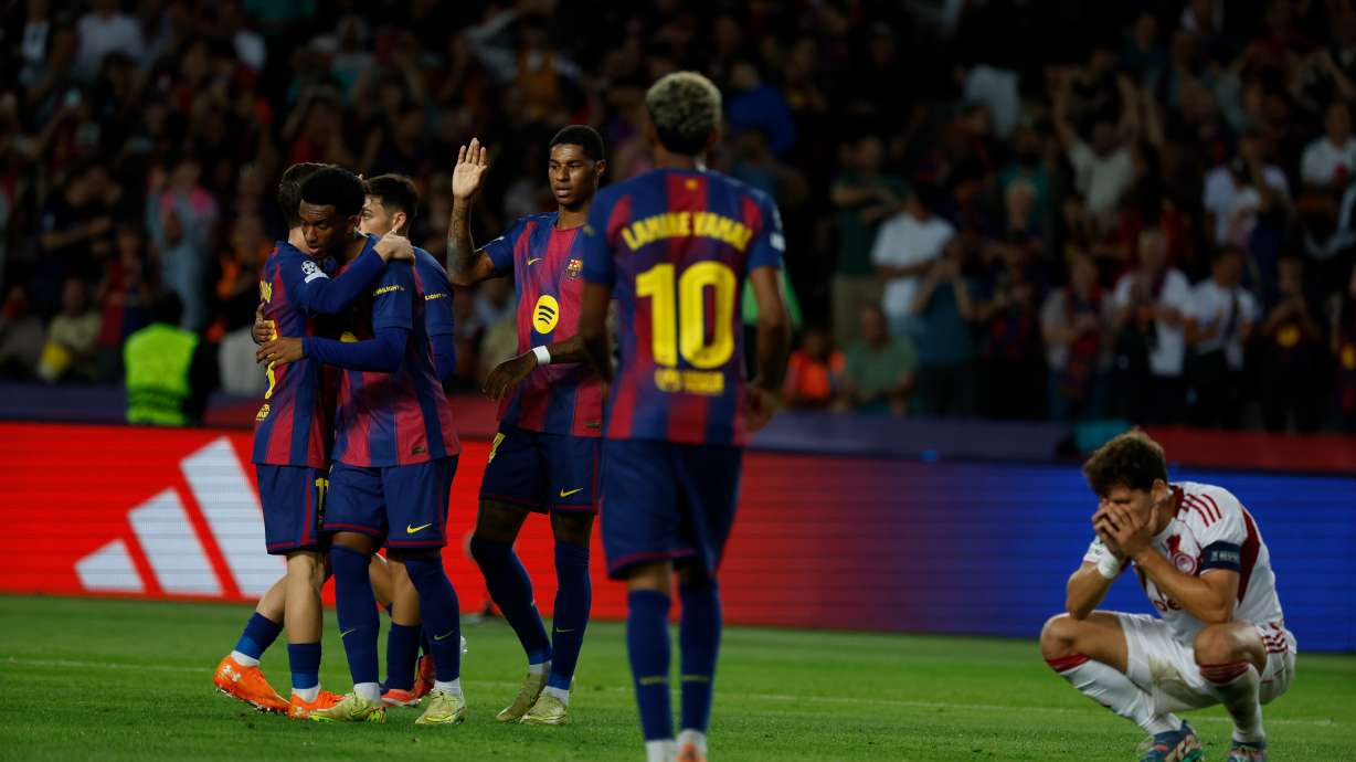 Barcelona's players celebrate the sixth goal of their team during the Champions League opening phase soccer match between Barcelona and Olympiacos in Barcelona, Spain, Tuesday, Oct. 21, 2025.