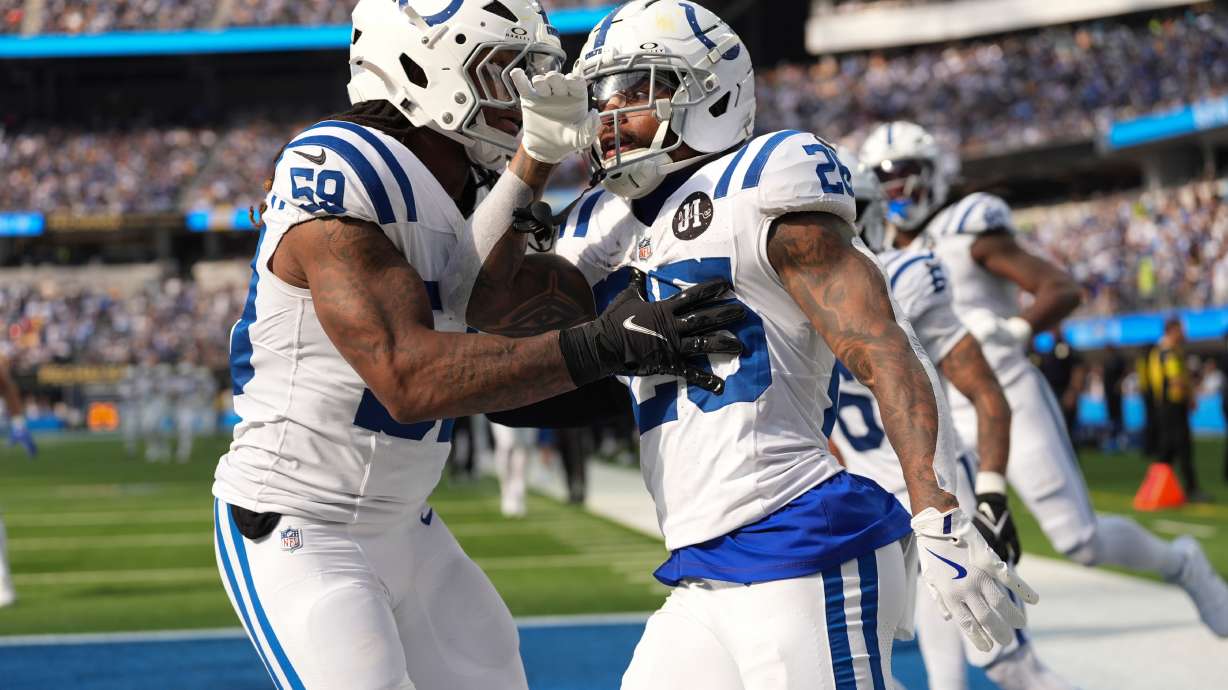 Indianapolis Colts running back Ameer Abdullah (26) celebrates a kickoff return with linebacker Buddy Johnson (59) against the Los Angeles Chargers during the second half of an NFL football game Sunday, Oct. 19, 2025, in Inglewood, Calif.