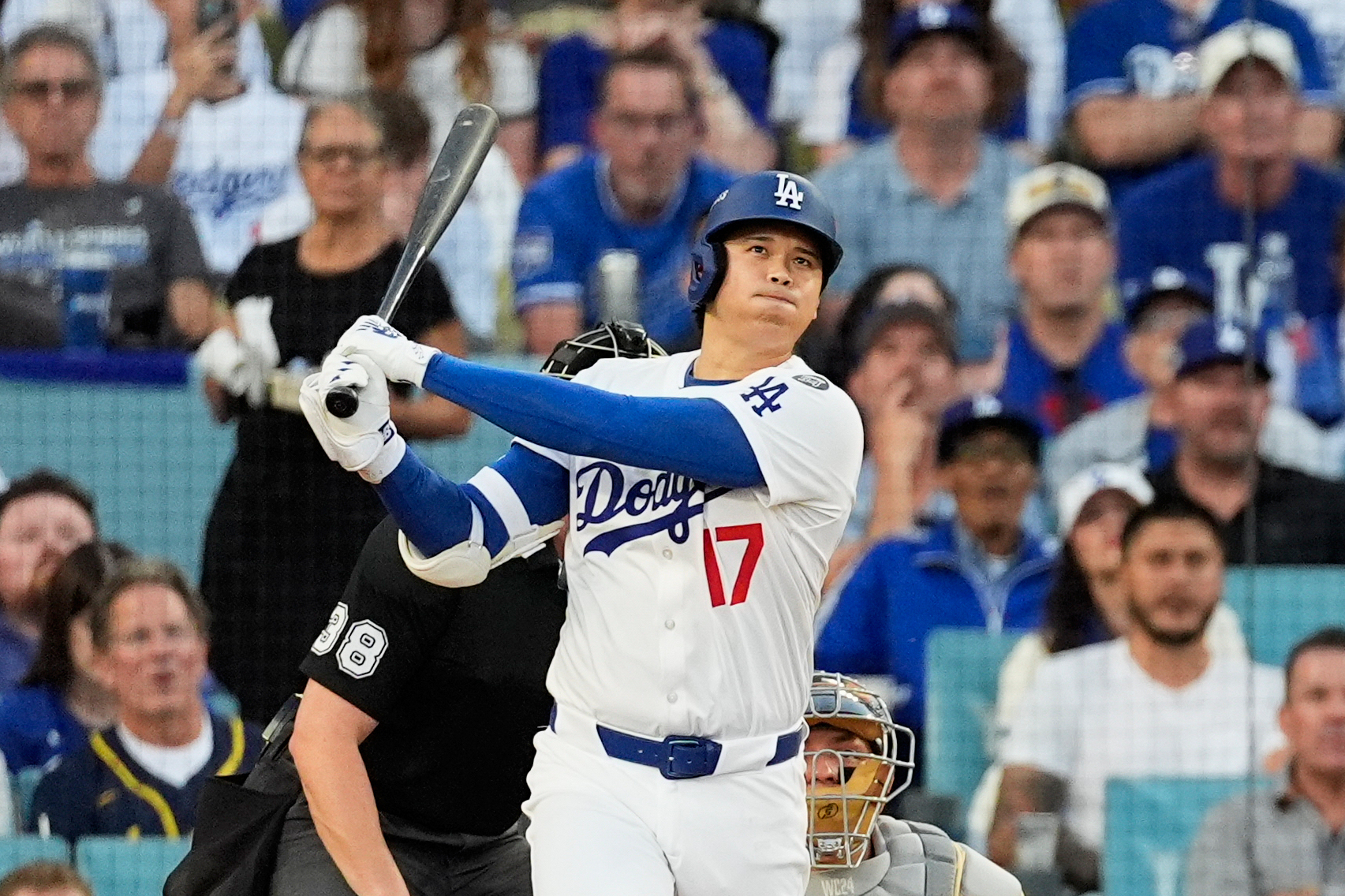 FILE - Los Angeles Dodgers' Shohei Ohtani watches his home run during the first inning against the Milwaukee Brewers in Game 4 in baseball's National League Championship Series, Friday, Oct. 17, 2025, in Los Angeles.
