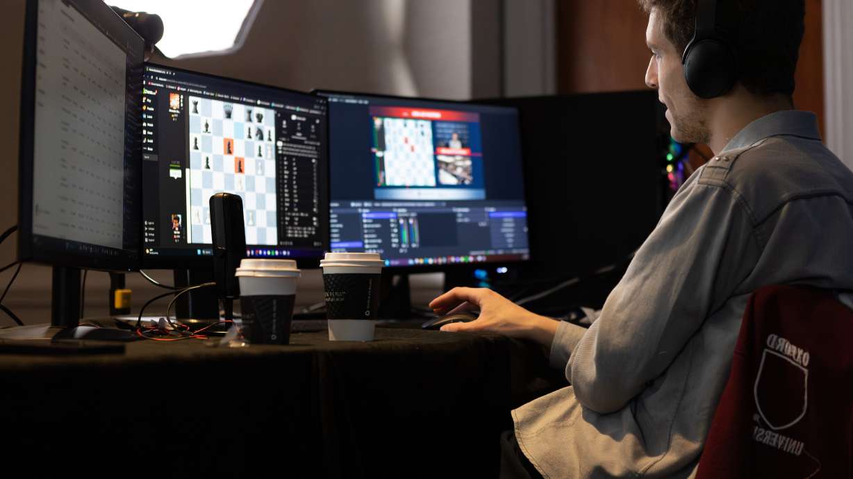 This undated photo released by Charlotte Chess Center shows Daniel Naroditsky playing chess at the computer.