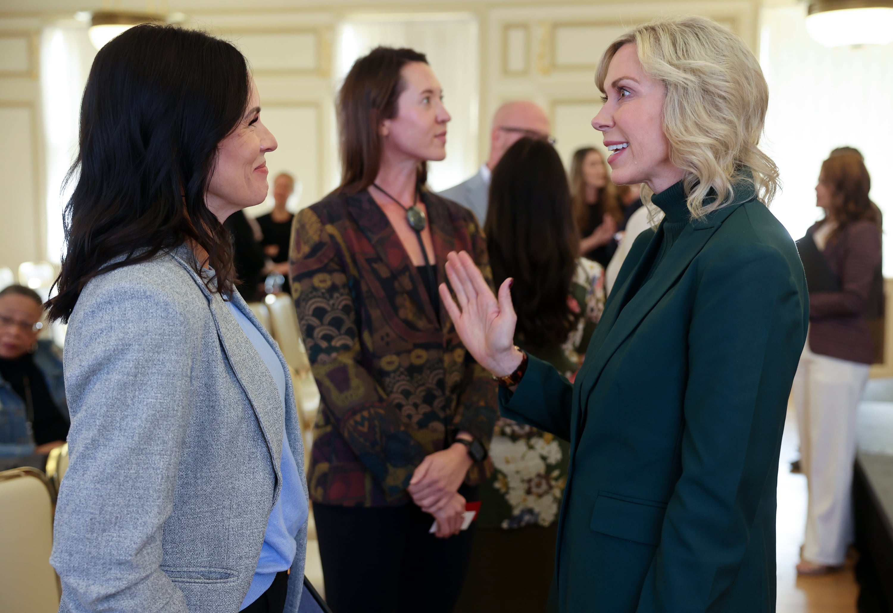 Jenney Rees, deputy state director for Utah Sen. John Curtis, talks with Amanda Covington, Utah System of Higher Education board chairwoman, after Covington participated in a “Dignity in the Public Discourse” panel discussion at the Kem C. Gardner Policy Institute Newsmaker Breakfast in Salt Lake City on Tuesday.