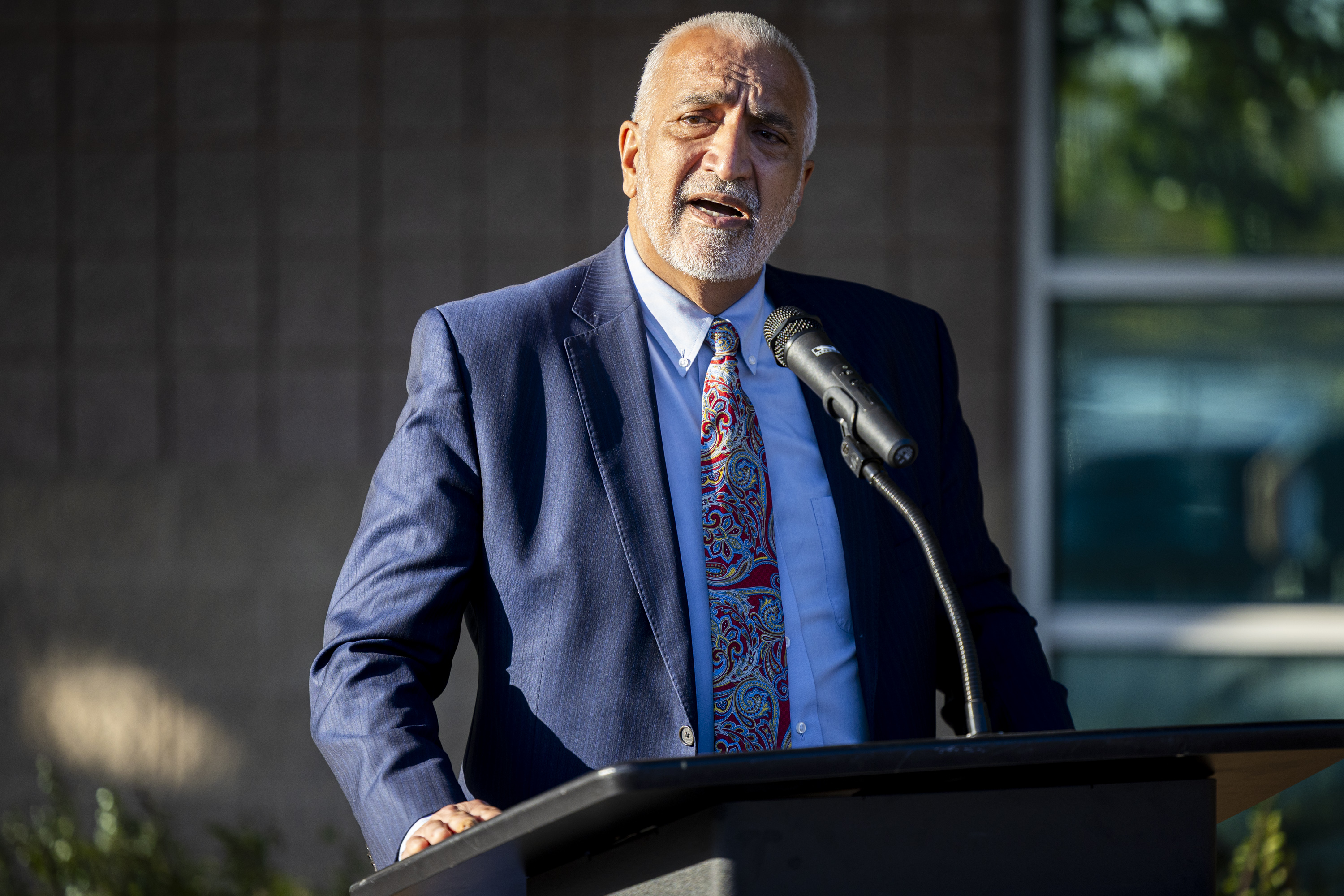 Salt Lake County District Attorney Sim Gill speaks during a vigil to honor the lives lost to gun violence in Utah within the past year, organized by the Gun Violence Prevention Center of Utah and held outside the West Valley City Family Fitness Center in West Valley City on Tuesday, Oct. 21, 2025.