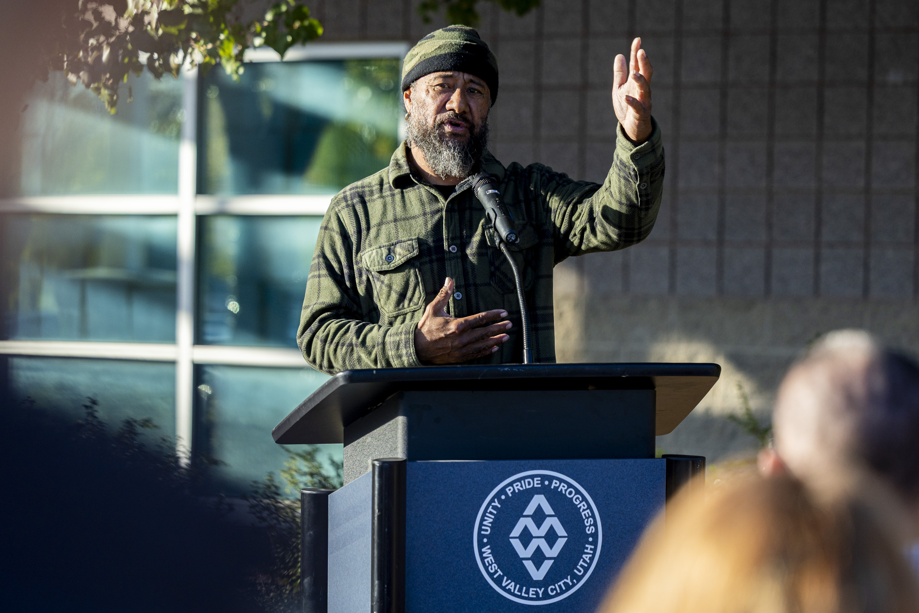 Siolo Toala, a member of Day Won Utah, speaks during a vigil to honor the lives lost to gun violence in Utah within the past year, organized by the Gun Violence Prevention Center of Utah and held outside the West Valley City Family Fitness Center in West Valley City on Tuesday, Oct. 21, 2025.
