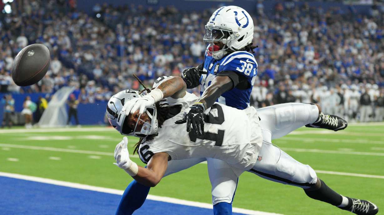 Indianapolis Colts' Chris Lammons (38) breaks up a pass intended for Las Vegas Raiders wide receiver Jakobi Meyers (16) during the second half of an NFL football game, Sunday, Oct. 5, 2025, in Indianapolis.