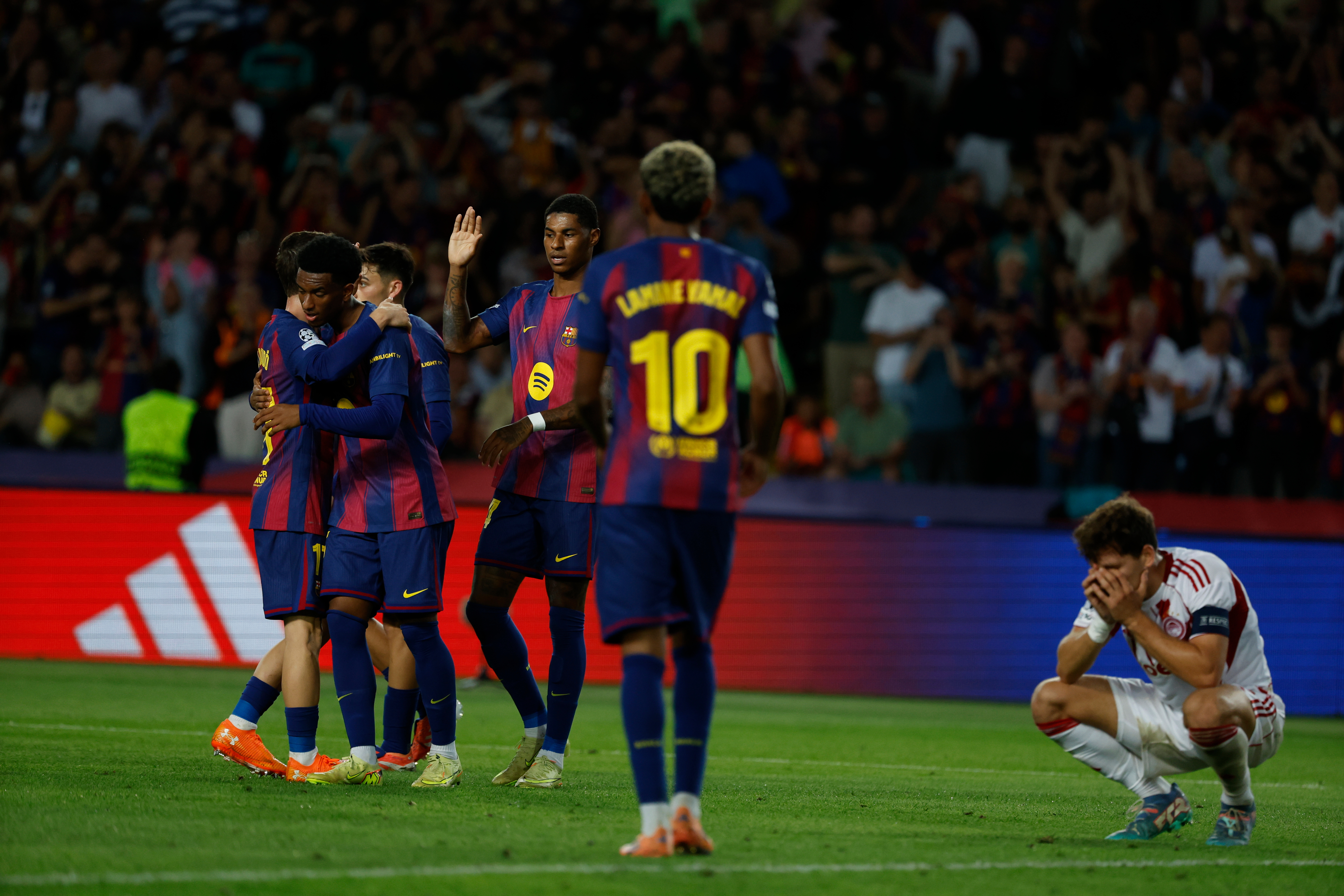 Barcelona's players celebrate the sixth goal of their team during the Champions League opening phase soccer match between Barcelona and Olympiacos in Barcelona, Spain, Tuesday, Oct. 21, 2025.