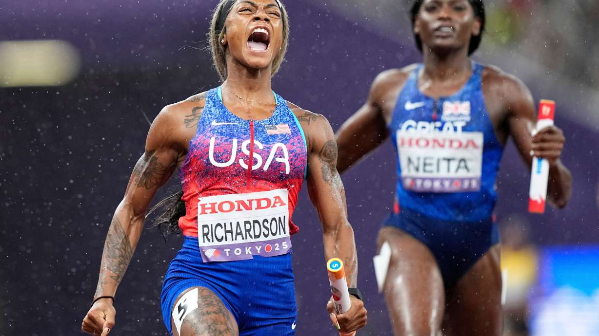 FILE - United States' Sha'Carri Richardson celebrates as she anchors the team to gold ahead of Britain's Daryll Neita in the women's 4 X 100 meters relay final at the World Athletics Championships in Tokyo, Sept. 21, 2025.
