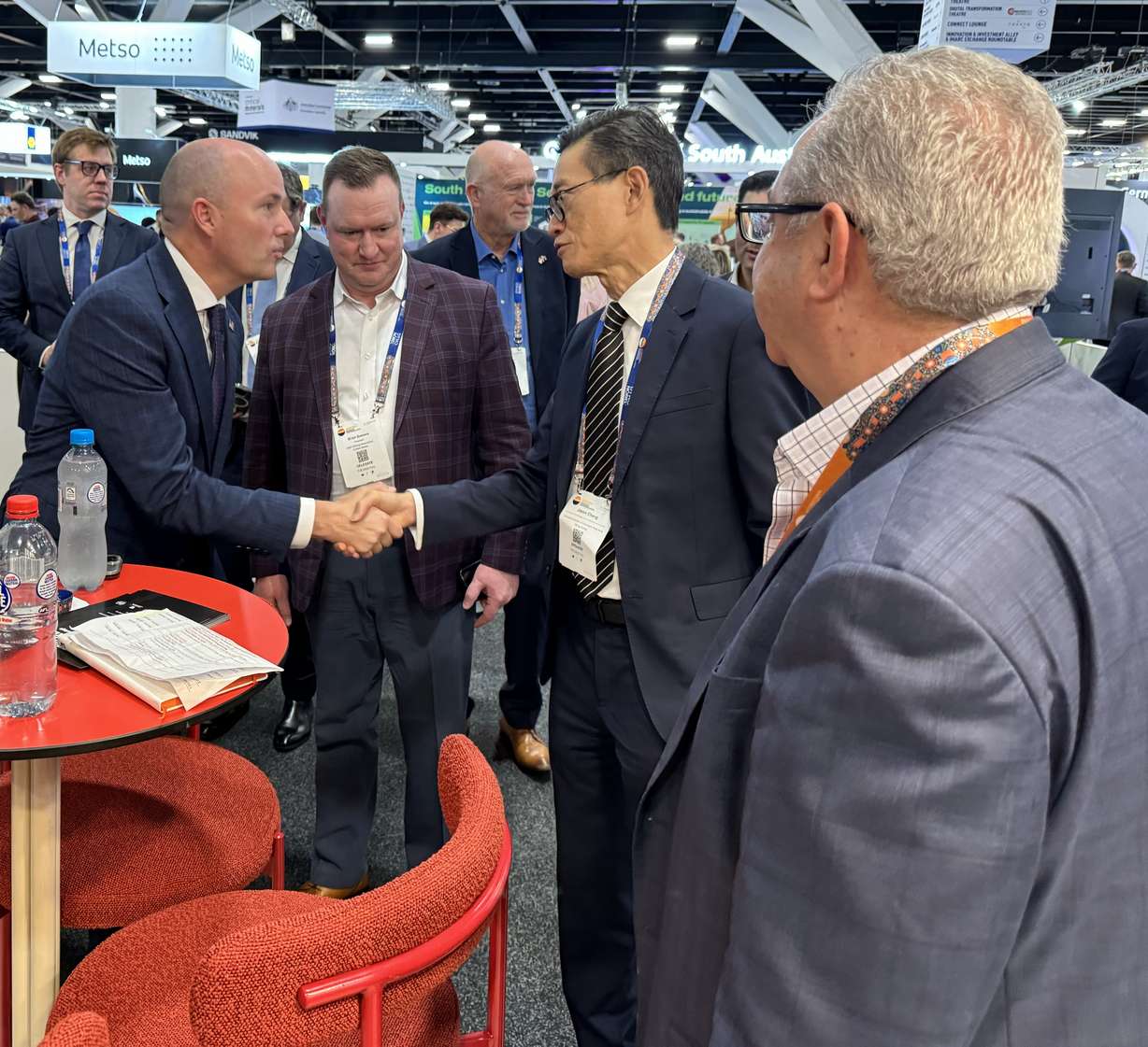 Utah Gov. Spencer Cox greets visitors at the Utah exhibit booth at the International Mining & Resources Conference in Sydney, Australia, on Wednesday.