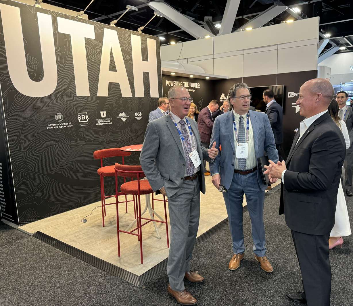 From left, Utah state Sens. Scott Sandall, R-Tremonton, and Chris Wilson, R-Logan, meet with Utah Department of Natural Resources Executive Director Joel Ferry near the Utah exhibit booth at the International Mining & Resources Conference in Sydney, Australia, on Wednesday.