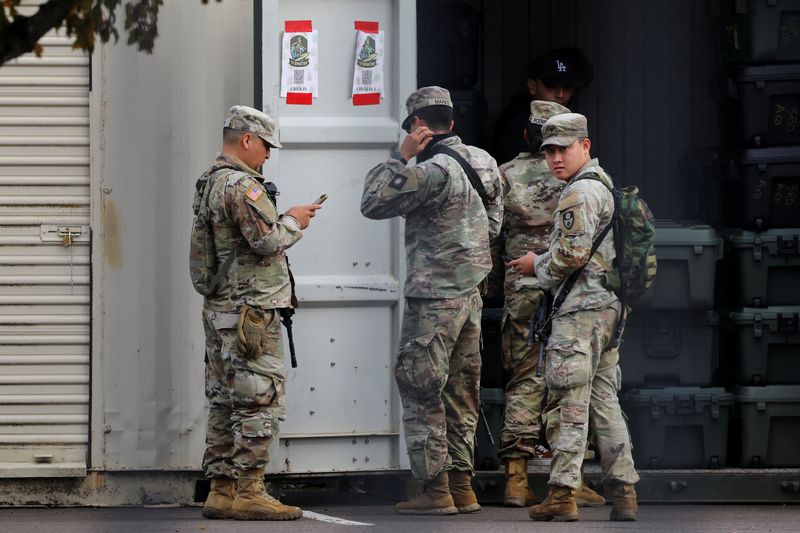 Members of the U.S. Army and Army National Guard at the Oregon Army National Guard's Camp Withycombe in Happy Valley, Ore., Wednesday. A divided appeals court ruled that President Donald Trump can send troops into Portland.