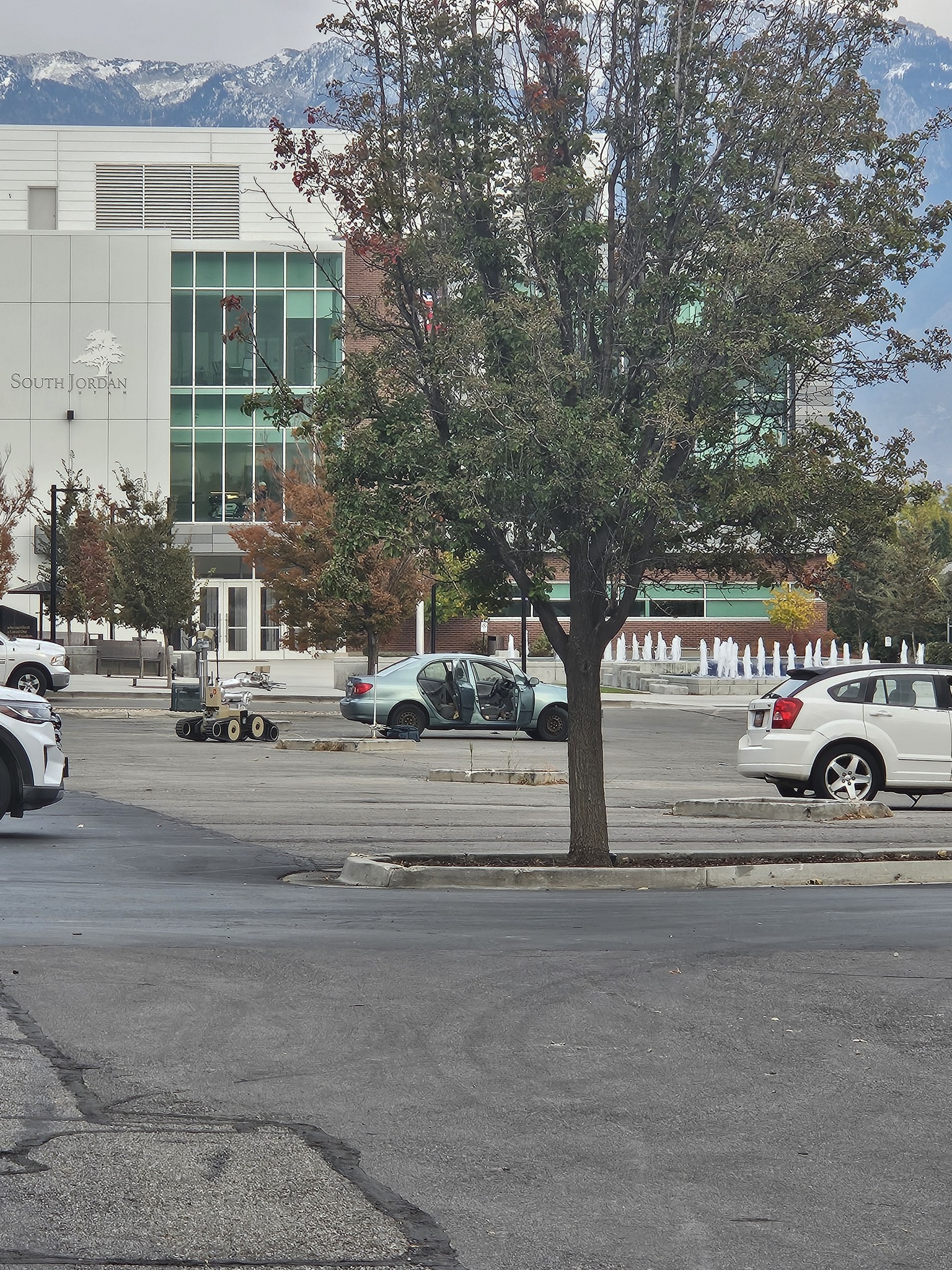 A bomb robot is seen as police investigate what was believed to be a bomb inside of a car in South Jordan Wednesday.