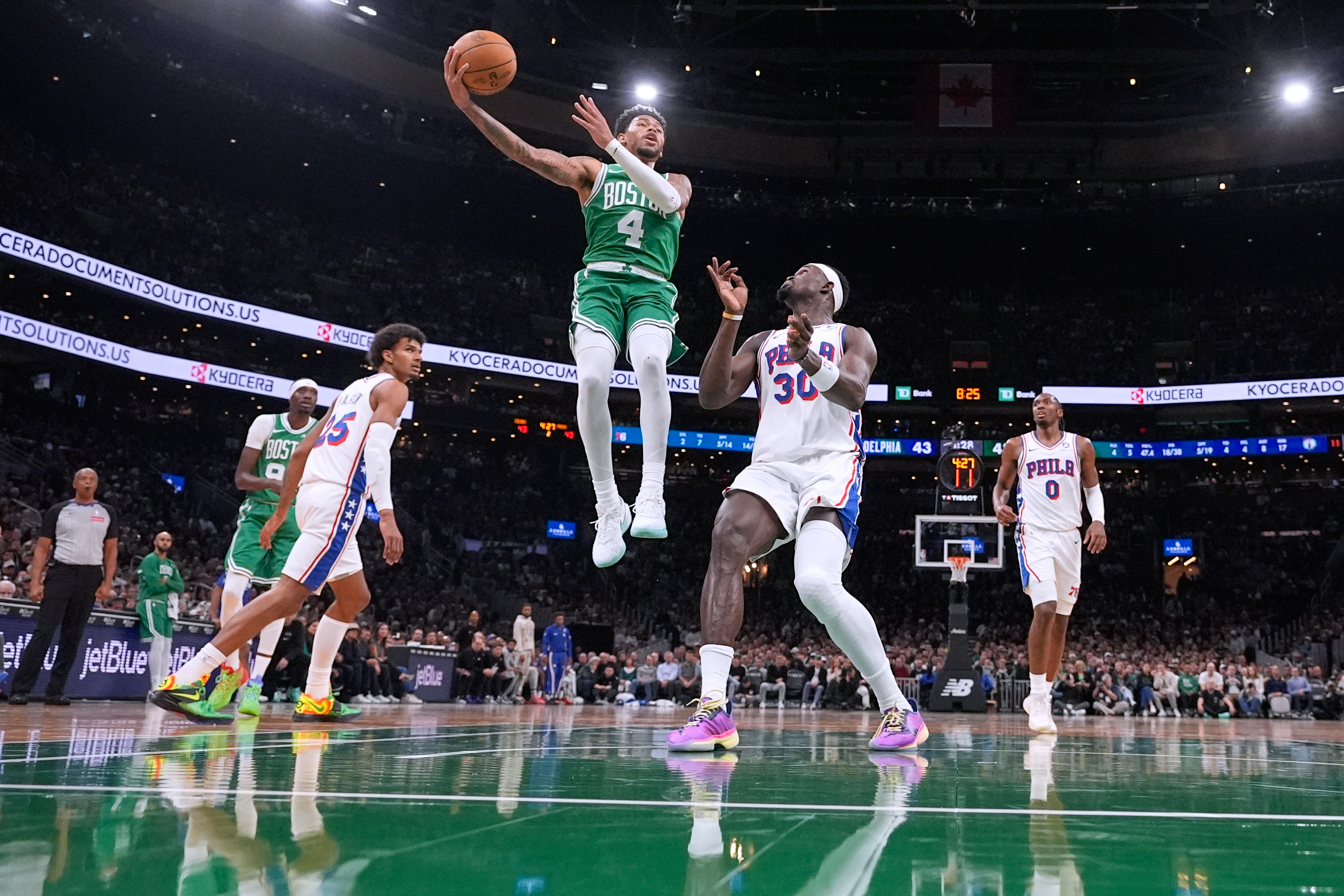 Boston Celtics guard Anfernee Simons (4) drives to the basket against the Philadelphia 76ers during the first half of an NBA basketball game, Wednesday, Oct. 22, 2025, in Boston. 