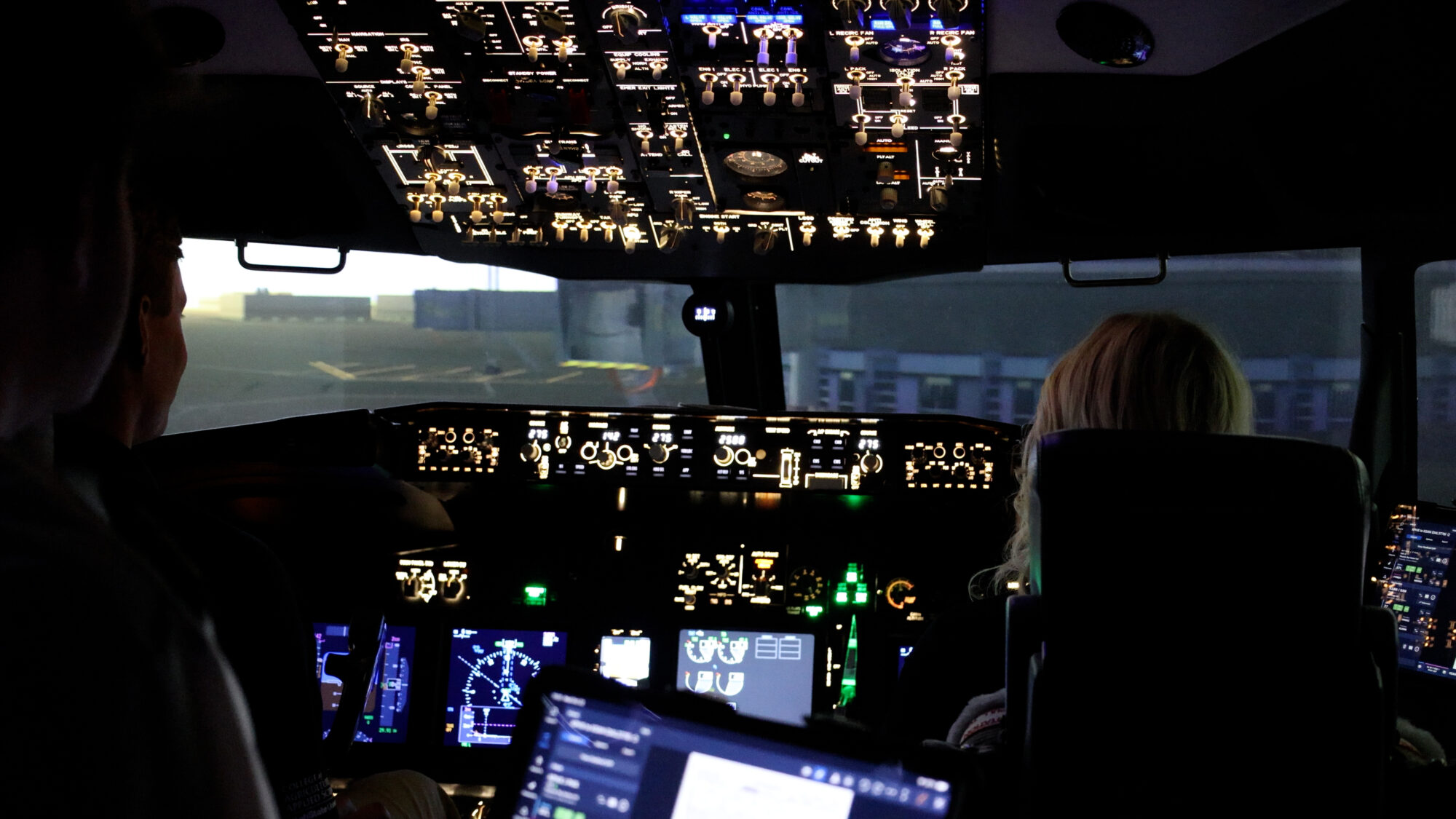 Ryan Peck and Sydney Steed inside a Boeing 737 simulator at Utah State University, Wednesday. Steed said flying is like no other feeling in the world.