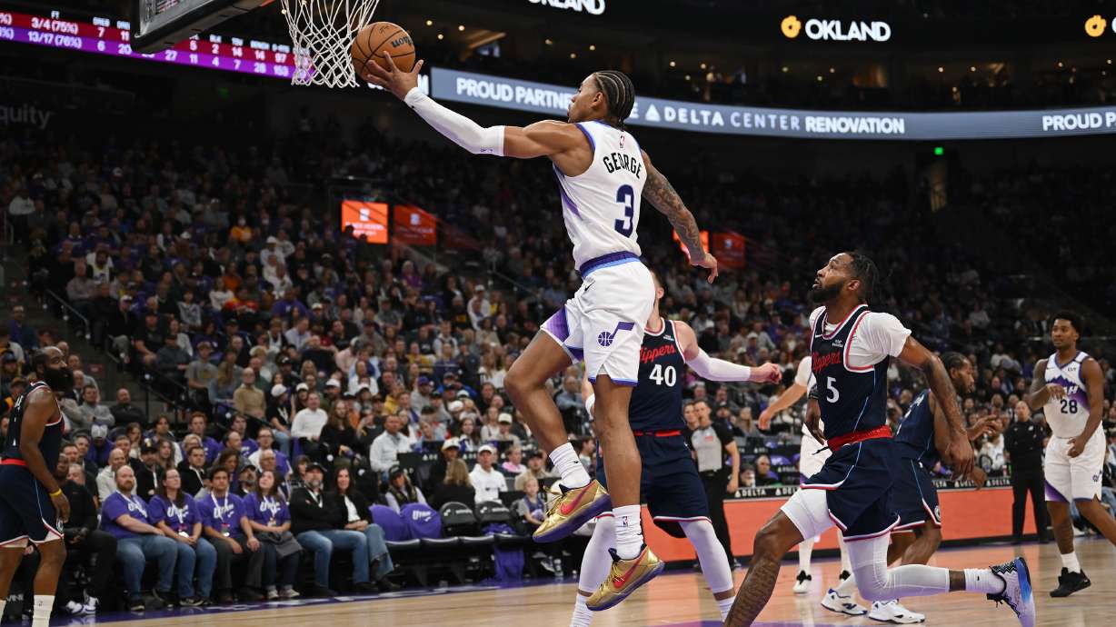 Utah Jazz guard Keyonte George (3) goes up at the hoop then passes the ball as the Jazz and Clippers play at the Delta Center in Salt Lake City on Wednesday, Oct. 22, 2025.