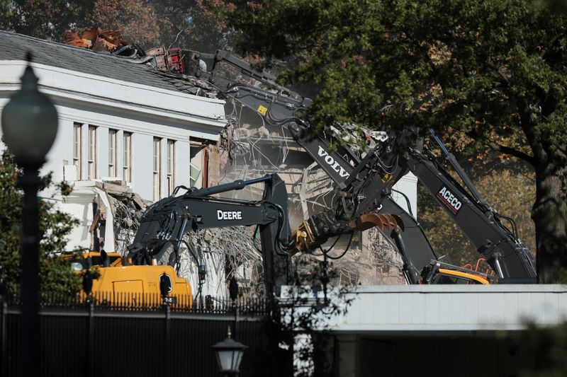 A demolition crew takes apart the facade of the East Wing of the White House, where President Donald Trump's proposed ballroom is being built, in Washington, Tuesday.