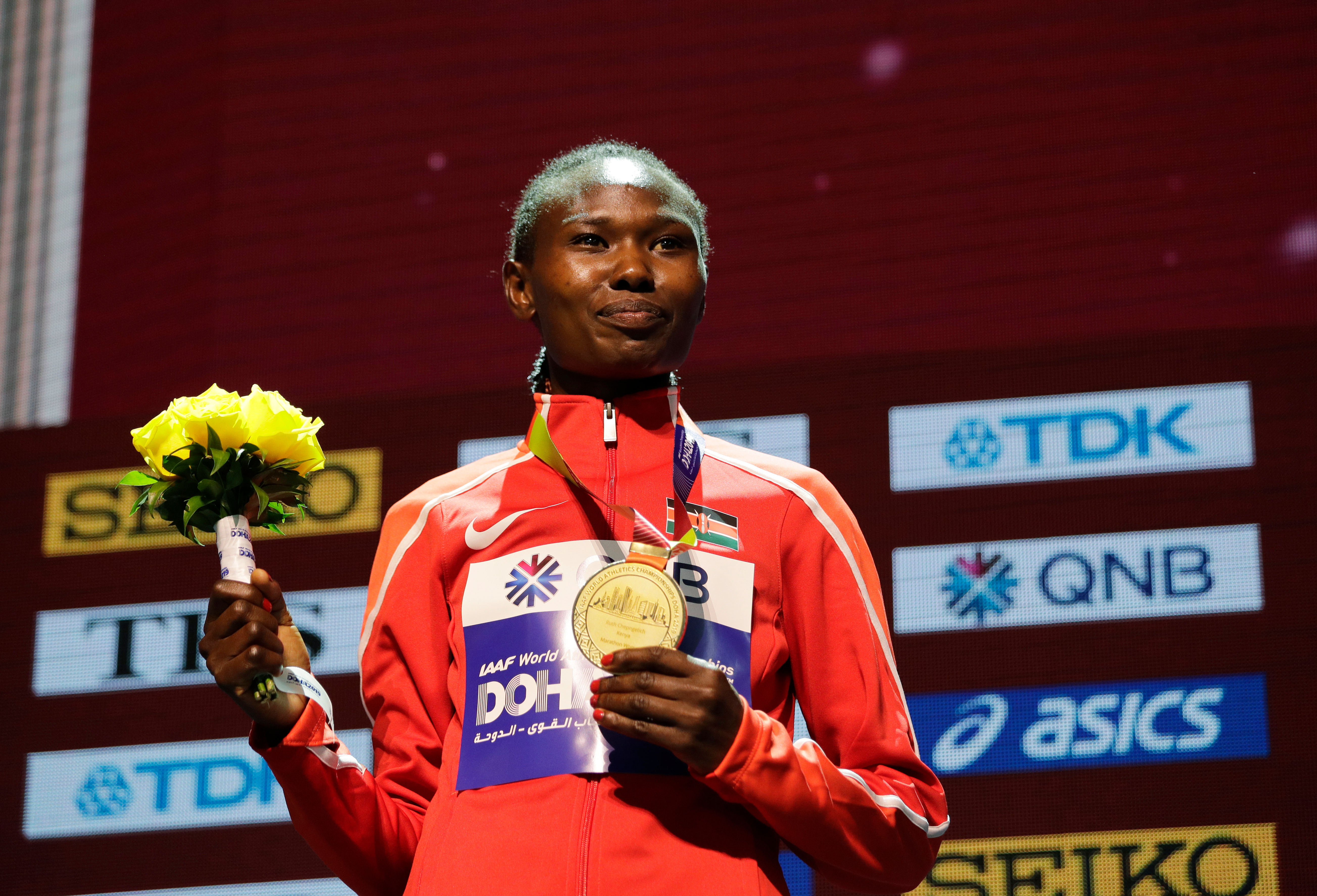 FILE - Kenya's Ruth Chepngetich poses with her gold medal during the medal ceremony for the women's marathon at the World Athletics Championships in Doha, Qatar, Sept. 28, 2019. 