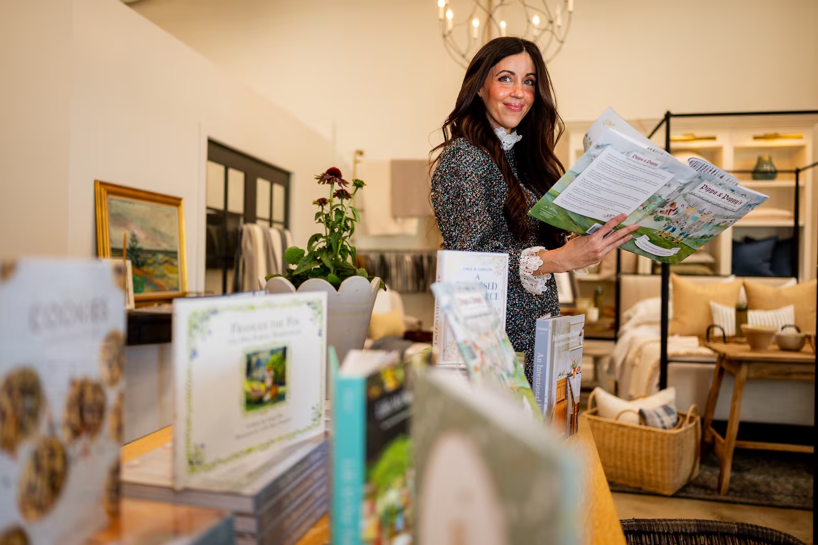 Tiffany Rosenhan, co-founder of a local publishing company, Jumelle Press, poses with books her company has published at Foundation Goods in South Salt Lake on Oct. 14. 