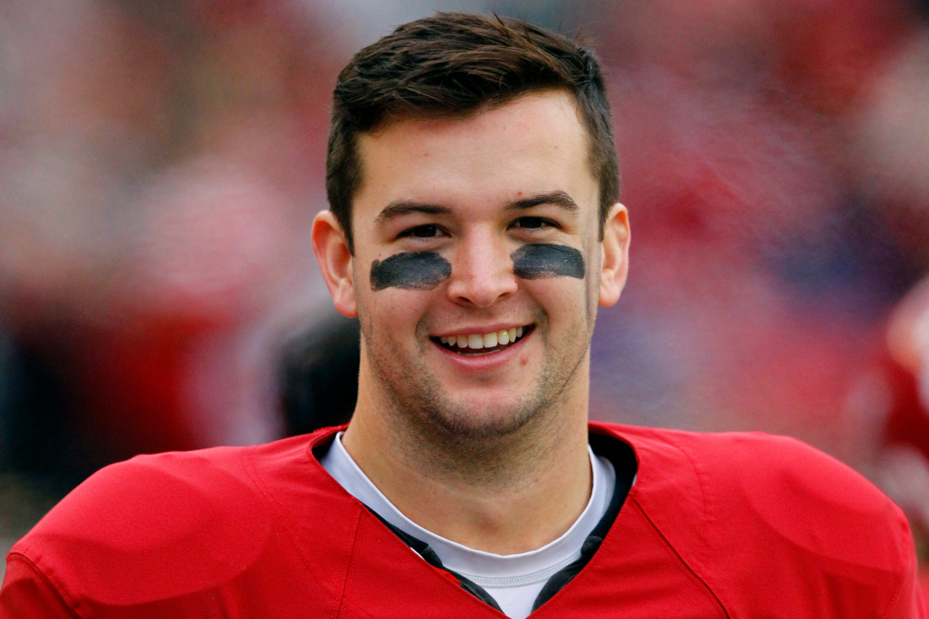 FILE - Alabama quarterback AJ McCarron (10) smiles on sideline during an NCAA college football game against Chattanooga in Tuscaloosa, Ala., Nov. 23, 2013.