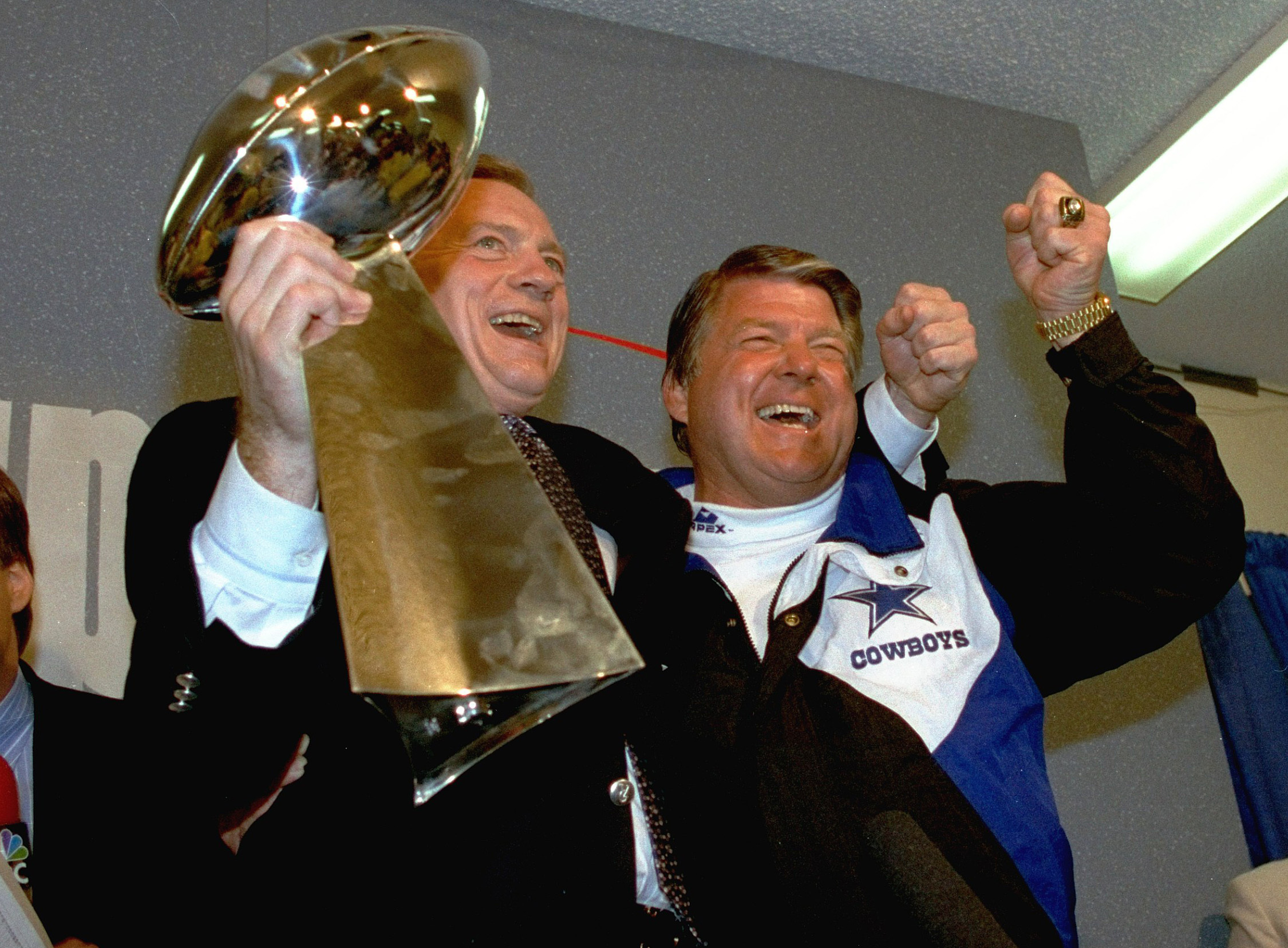 FILE - In this Jan. 31, 1993 file photo, Dallas Cowboys head coach Jimmy Johnson, right, and owner Jerry Jones, hold up the Vince Lombardi Trophy as they celebrate their 52-17 win over the Buffalo Bills in Super Bowl XXVII in Pasadena, Calif. 