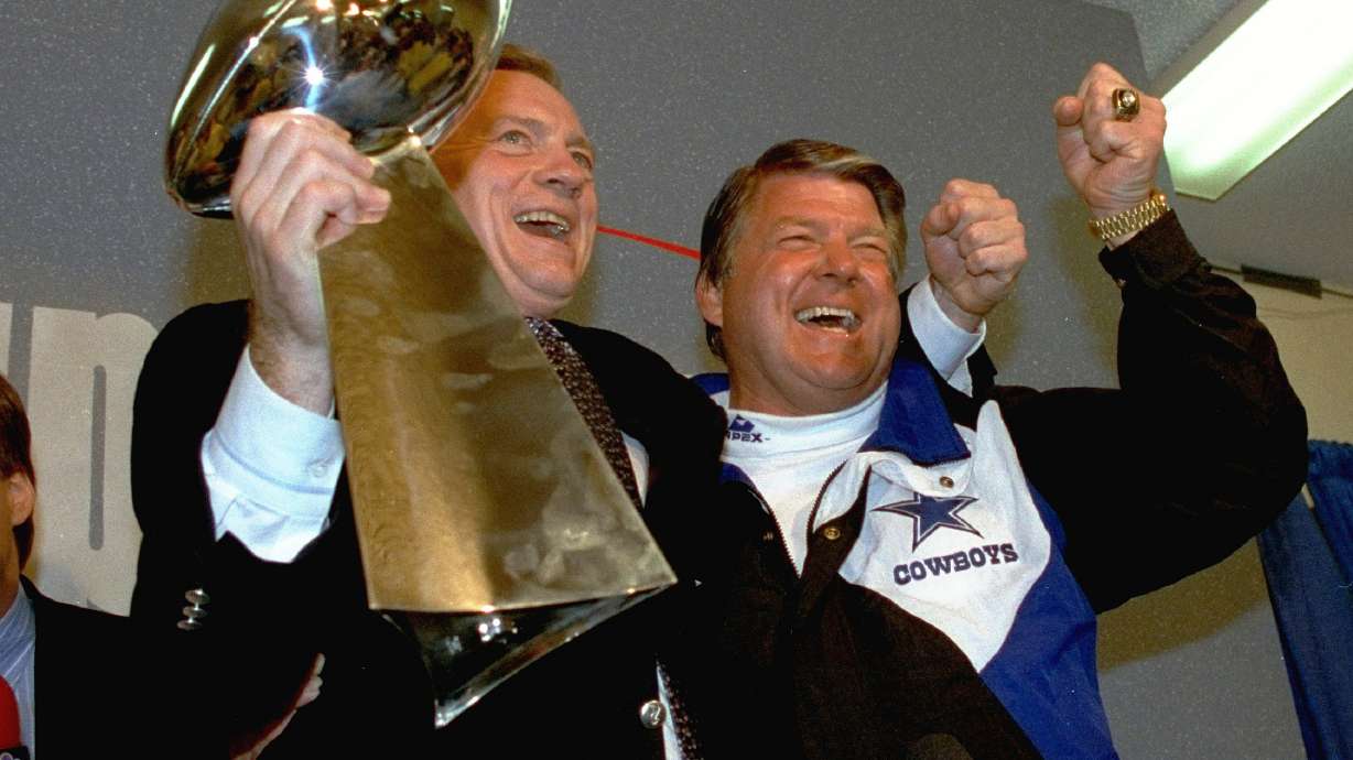 FILE - In this Jan. 31, 1993 file photo, Dallas Cowboys head coach Jimmy Johnson, right, and owner Jerry Jones, hold up the Vince Lombardi Trophy as they celebrate their 52-17 win over the Buffalo Bills in Super Bowl XXVII in Pasadena, Calif.