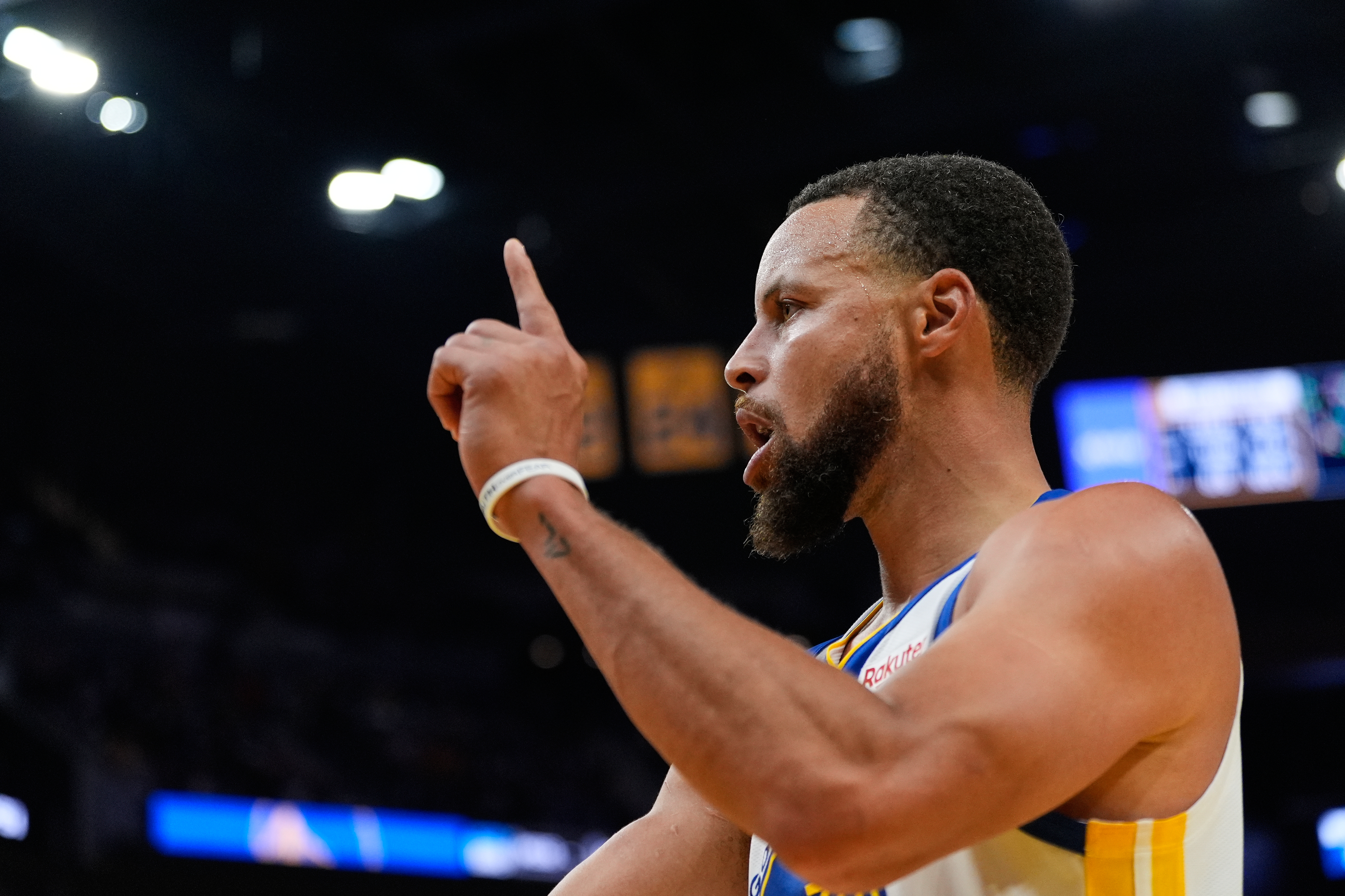 Golden State Warriors guard Stephen Curry reacts after scoring during the second half of an NBA basketball game against the Denver Nuggets, Thursday, Oct. 23, 2025, in San Francisco. 