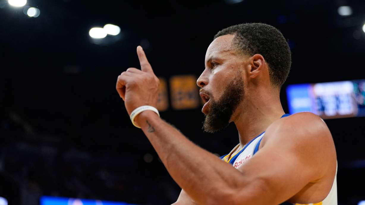 Golden State Warriors guard Stephen Curry reacts after scoring during the second half of an NBA basketball game against the Denver Nuggets, Thursday, Oct. 23, 2025, in San Francisco.