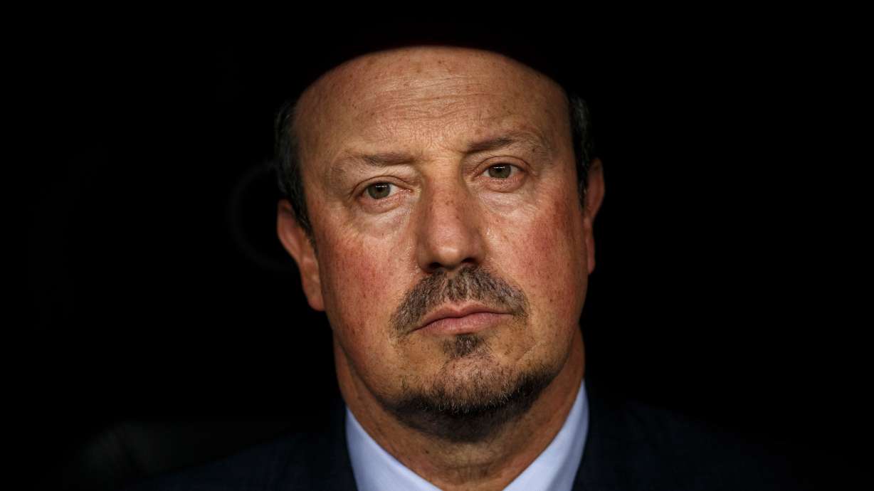 FILE -Real Madrid's head coach Rafa Benitez sits on the bench moments before the Santiago Bernabeu trophy soccer match between Real Madrid and Galatasaray at the Santiago Bernabeu stadium, in Madrid, Aug. 18, 2015.