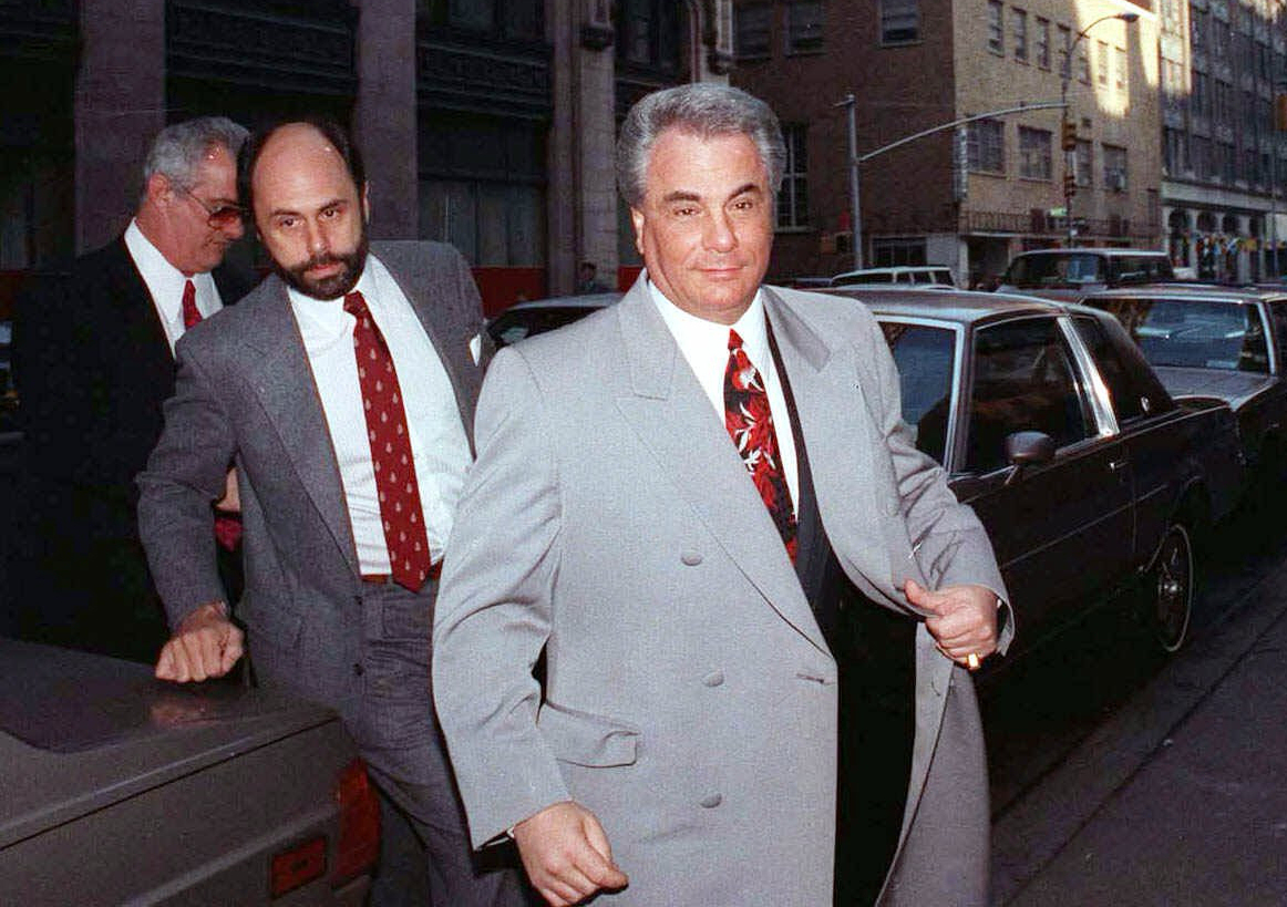 FILE - John Gotti, right, arrives at court with his attorney Attorney Gerald Schargel, center, and his brother Peter Gotti, left, on Feb.9, 1990, in New York.
