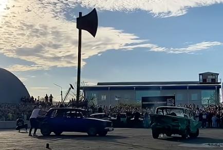 An "axe-car" cuts apart another car in this video on Oct. 22, 2023, in Krasnodar, Russia.