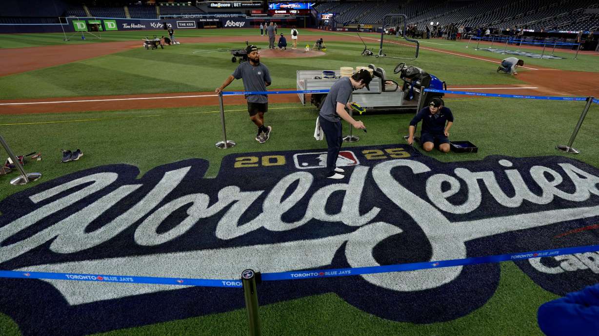 Grounds crewmembers work on the World Series logo, Thursday in Toronto. Utah is one of only four states rooting for the Los Angeles Dodgers in the fall classic, according to a new report.