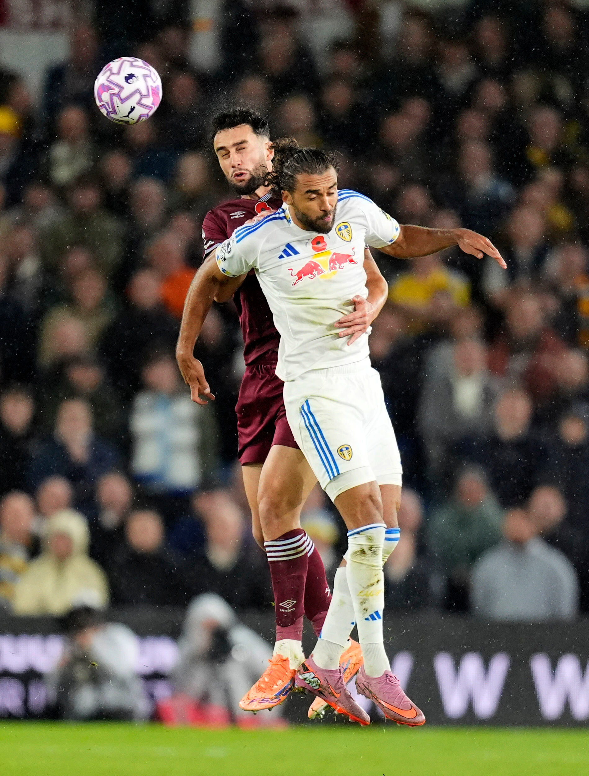 West Ham United's Max Kilman, rear, and Leeds United's Dominic Calvert-Lewin in action during the English Premier League soccer match between Leeds United and West Ham United at Elland Road, Leeds, England, Friday Oct. 24, 2025. 