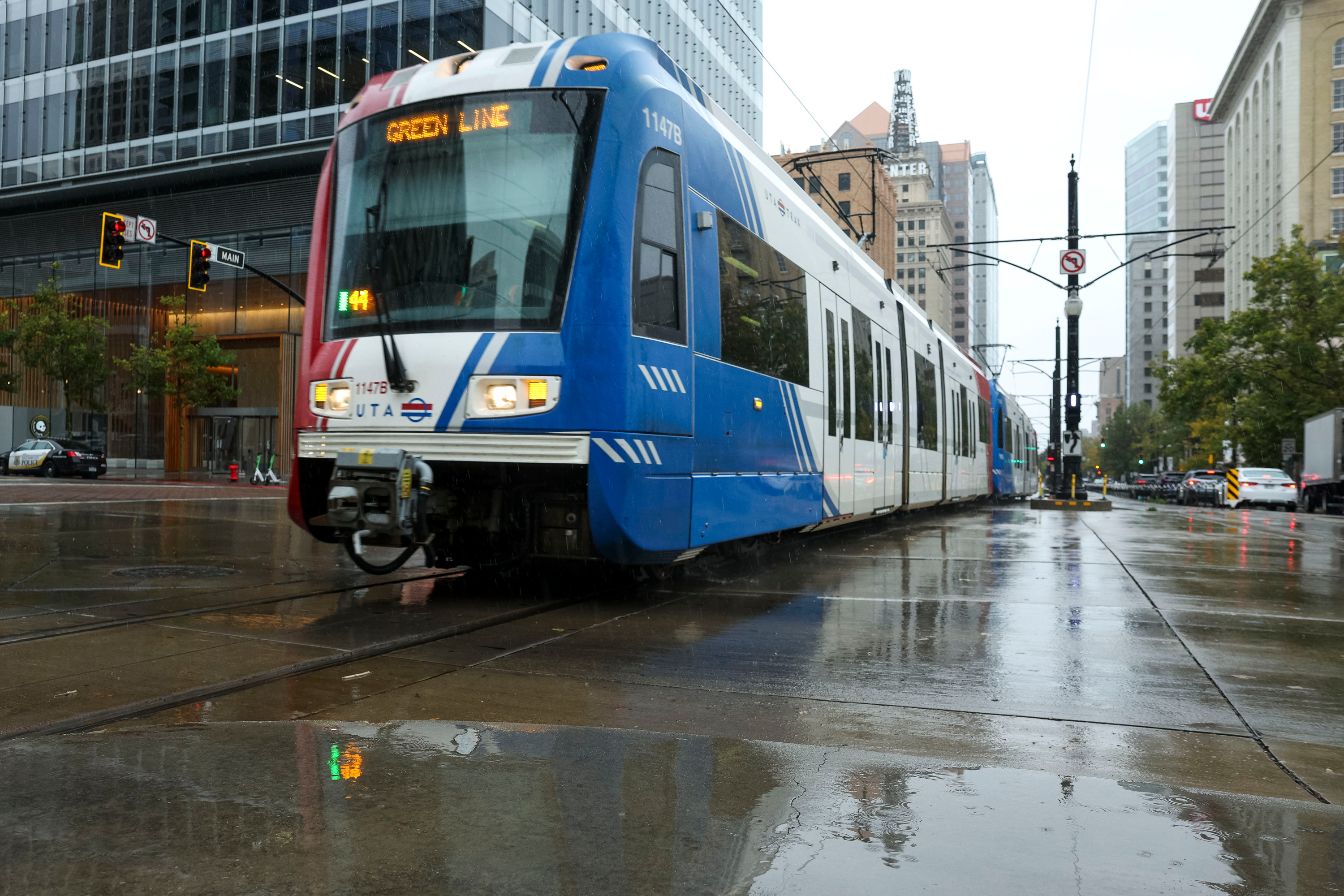 A TRAX train makes its way through an intersection in downtown Salt Lake City on Oct. 4, 2025. An I-215 bridge project will create headaches for green line TRAX riders heading to the west side of the city and the airport this weekend.