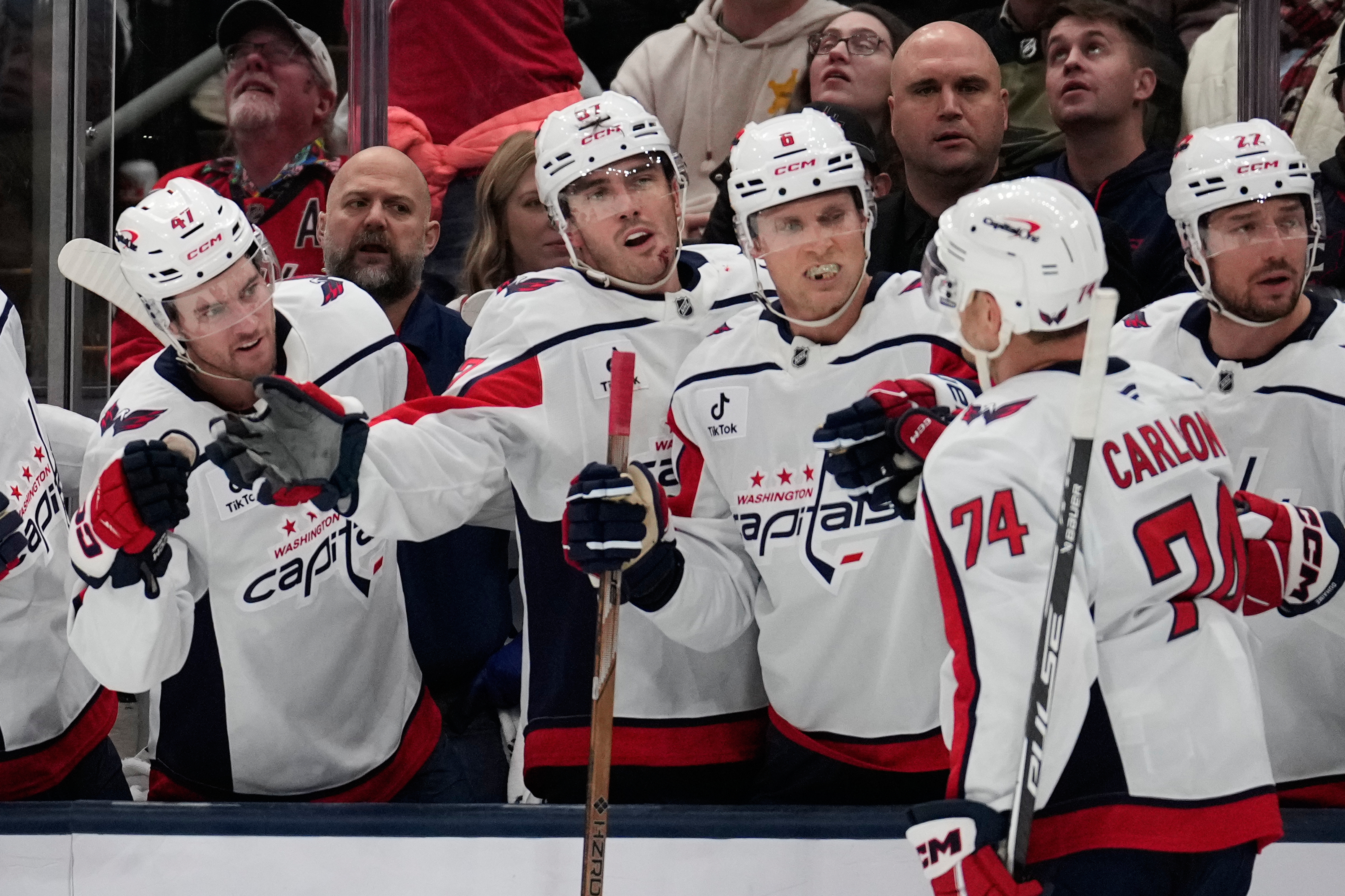 Washington Capitals defenseman John Carlson (74) is congratulated by teammates after scoring in the second period of an NHL hockey game against the Columbus Blue Jackets Friday, Oct. 24, 2025, in Columbus, Ohio.
