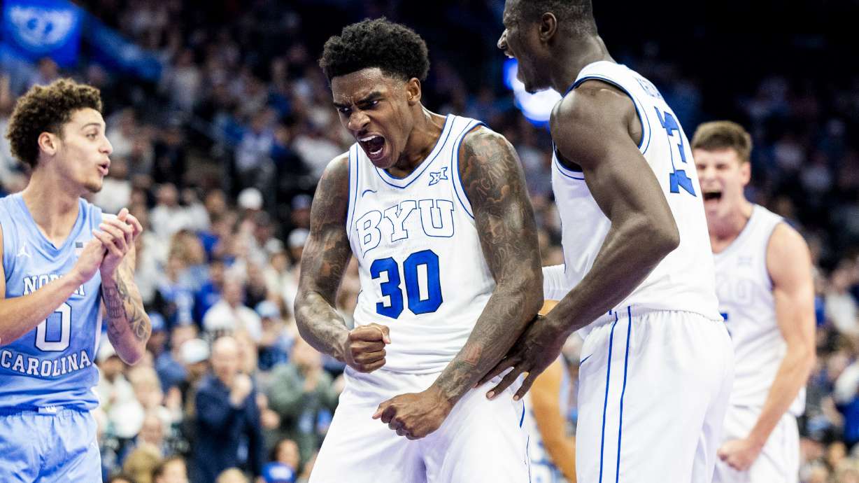 BYU guard Kennard Davis Jr. (30) celebrates after a play with center Keba Keita (13) during an NCAA men’s basketball exhibition game against North Carolina held at the Delta Center in Salt Lake City on Friday, Oct. 24, 2025.