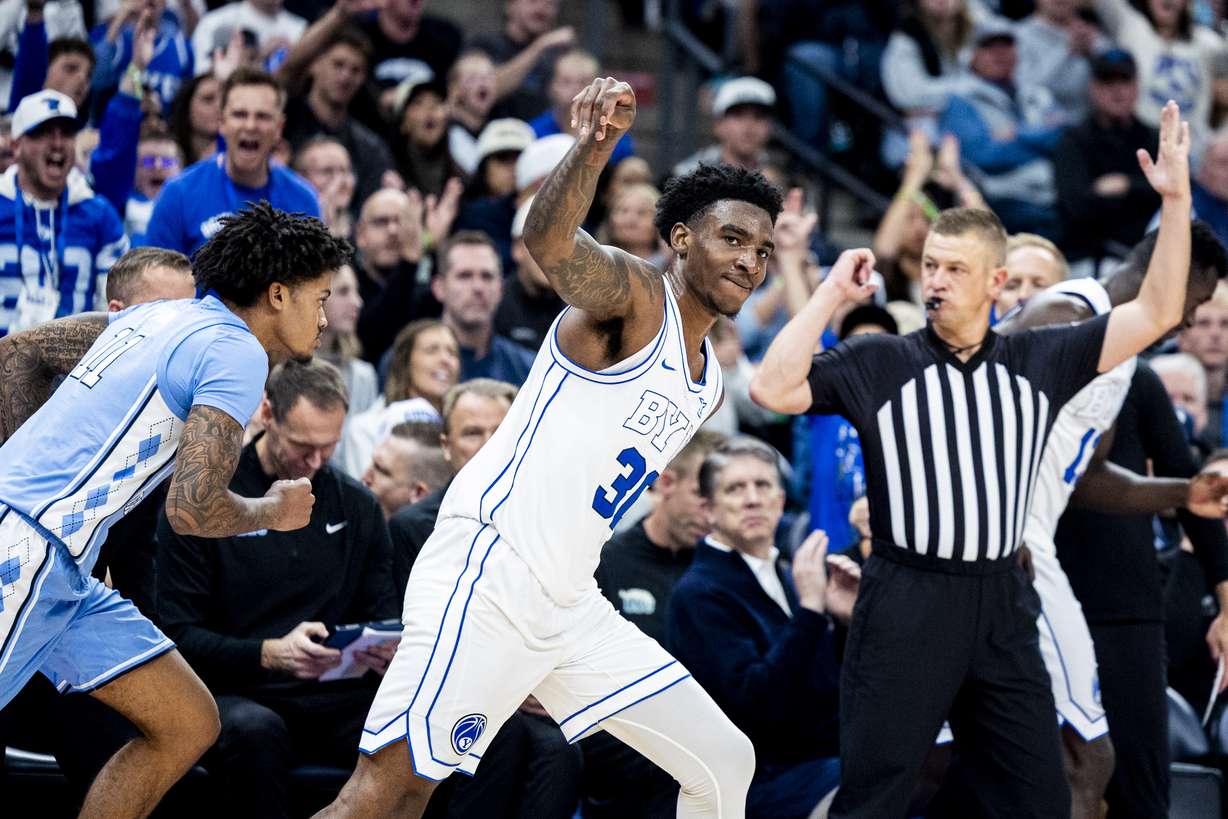 BYU guard Kennard Davis Jr. (30) holds his follow-through on his made three-pointer during an NCAA men’s basketball exhibition game against North Carolina held at the Delta Center in Salt Lake City on Friday, Oct. 24, 2025.