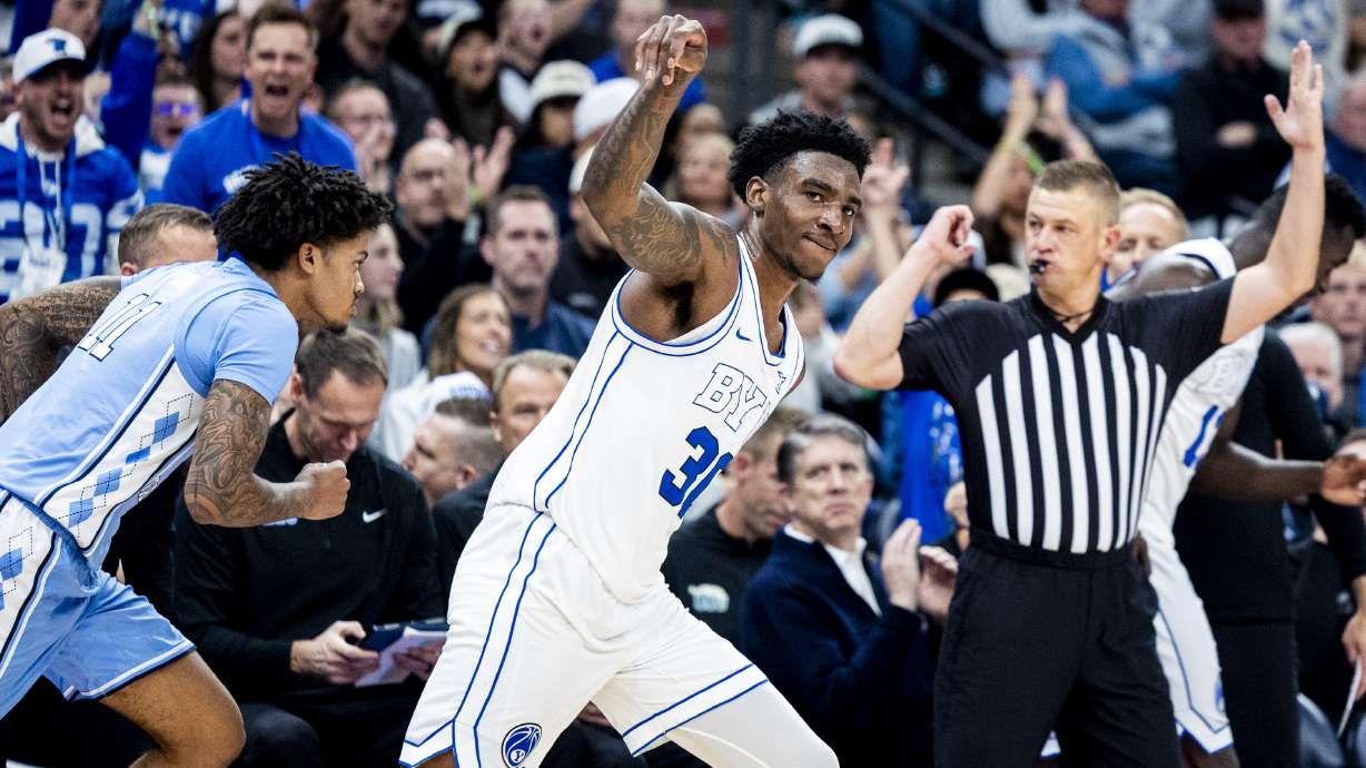 BYU guard Kennard Davis Jr. (30) holds his follow-through on his made three-pointer during an NCAA men’s basketball exhibition game against North Carolina held at the Delta Center in Salt Lake City on Friday, Oct. 24, 2025.