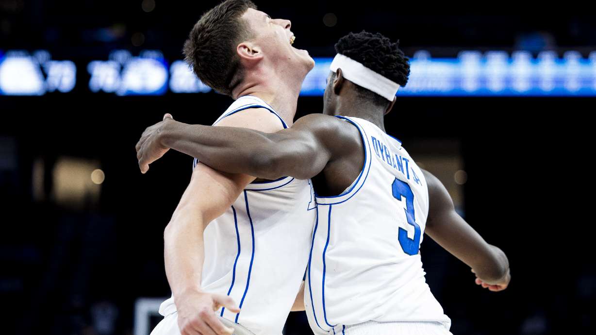BYU forward Mihailo Boskovic (5) and forward AJ Dybantsa (3) celebrate after a play during an NCAA men’s basketball exhibition game against North Carolina held at the Delta Center in Salt Lake City on Friday, Oct. 24, 2025.