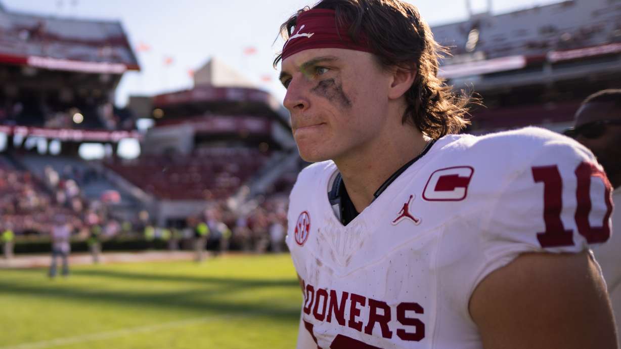 Oklahoma quarterback John Mateer (10) walks off after defeating South Carolina in an NCAA college football game, Saturday, Oct. 18, 2025, in Columbia, S.C.