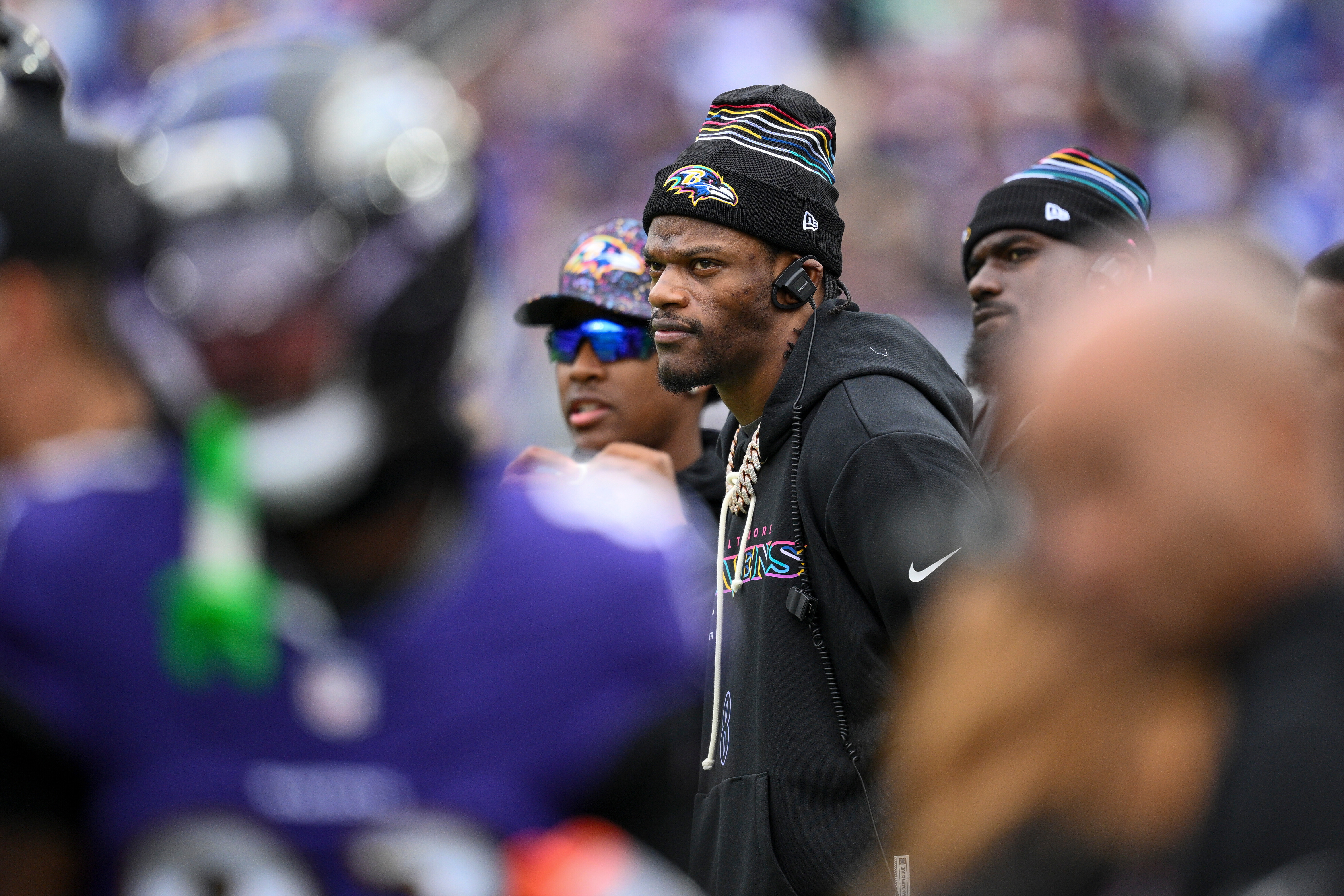 Baltimore Ravens quarterback Lamar Jackson looks on from the sidelines during the first half of an NFL football game against the Los Angeles Rams Sunday, Oct. 12, 2025, in Baltimore. 
