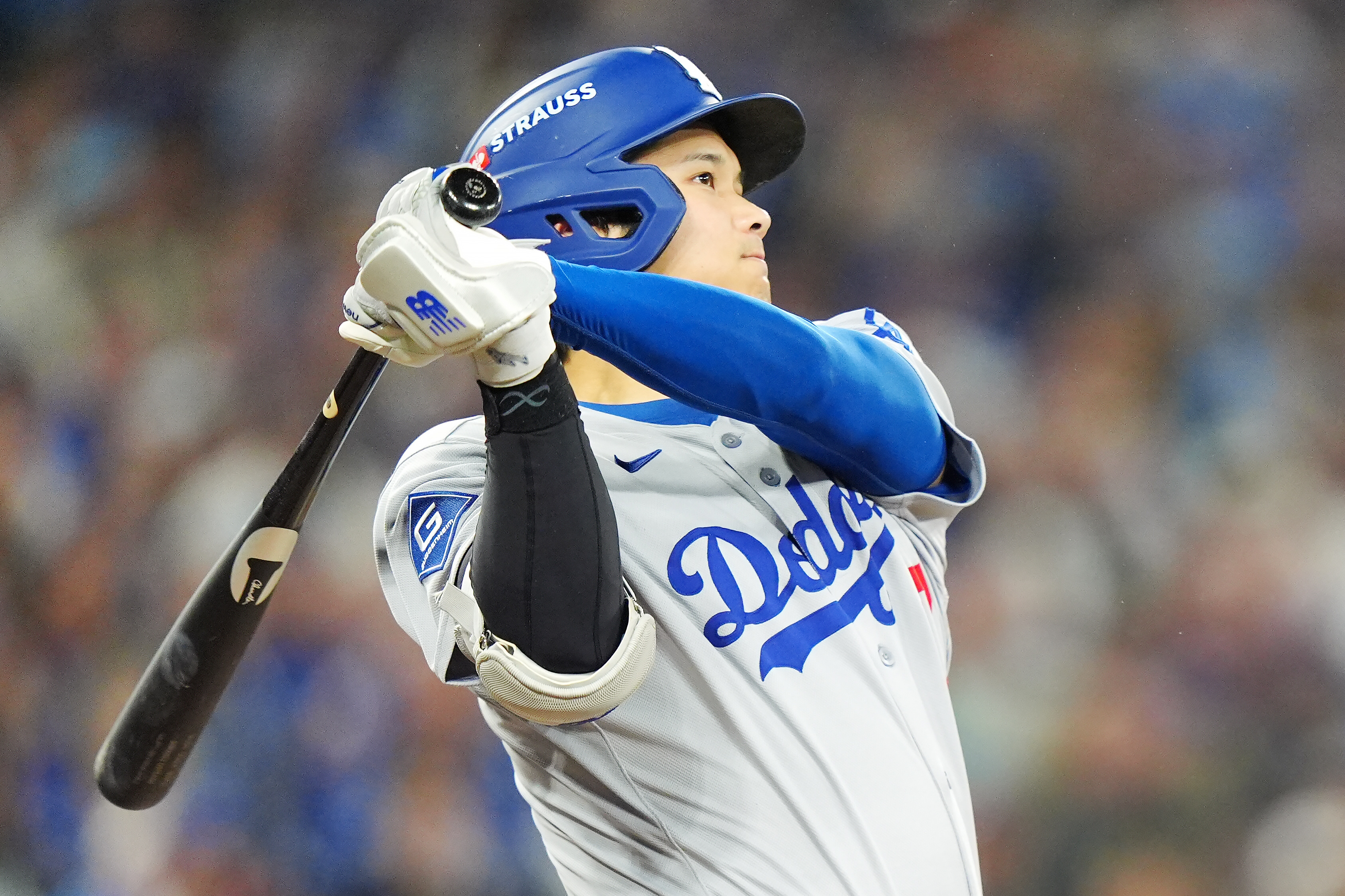 Los Angeles Dodgers' Shohei Ohtani hits a two-run home run against the Toronto Blue Jays during the seventh inning of Game 1 of baseball's World Series in Toronto, Friday, Oct. 24, 2025.
