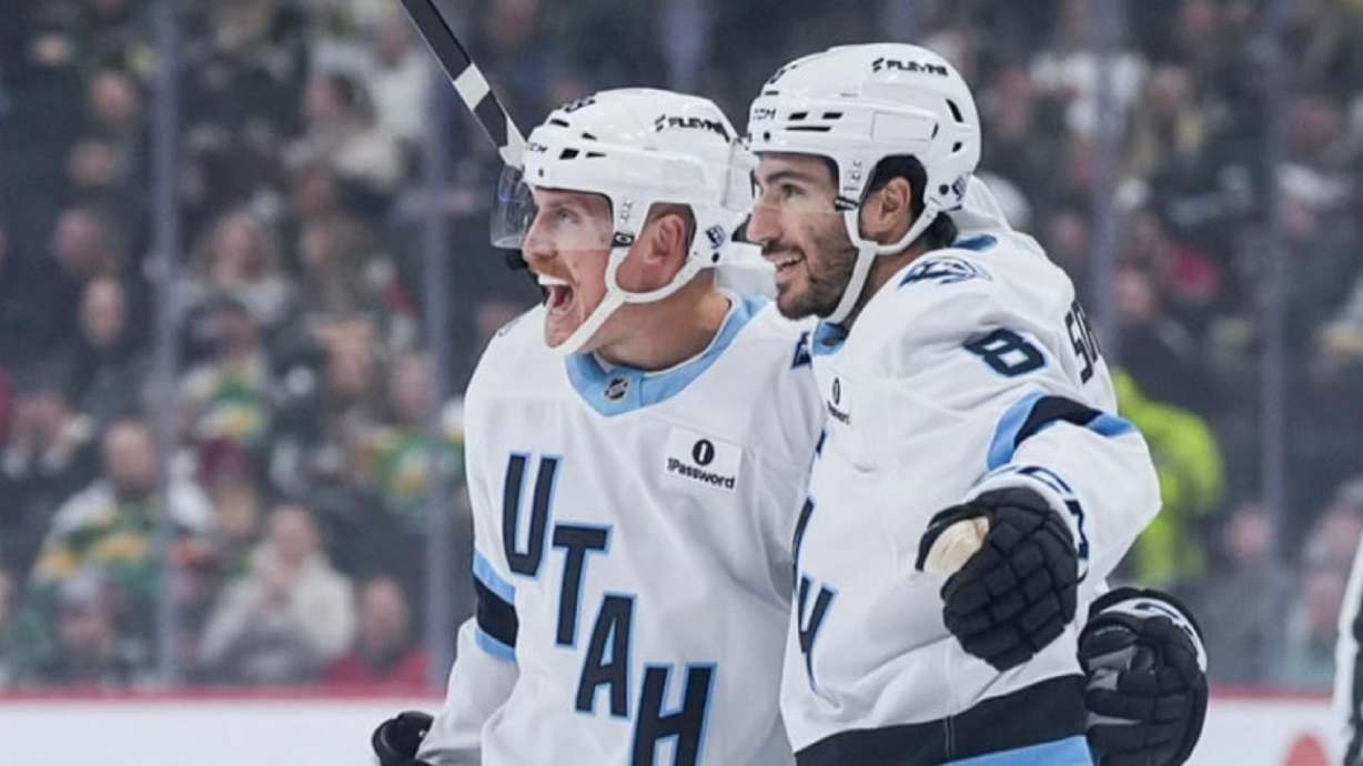Nate Schmidt, left, and Nick Schmaltz celebrate a goal in Minnesota.