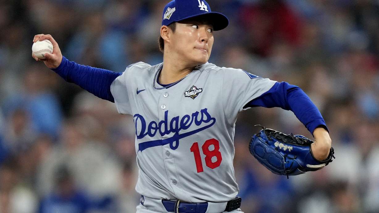 Los Angeles Dodgers pitcher Yoshinobu Yamamoto (18) delivers during the sixth inning in Game 2 of baseball's World Series against the Toronto Blue Jays, Saturday, Oct. 25, 2025, in Toronto.
