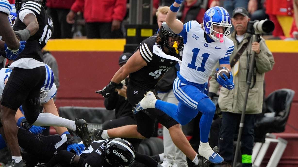 BYU wide receiver Parker Kingston (11) runs the ball as he gets free from Iowa State's defense during the first half of an NCAA college football game, Saturday, Oct. 25, 2025, in Ames, Iowa.