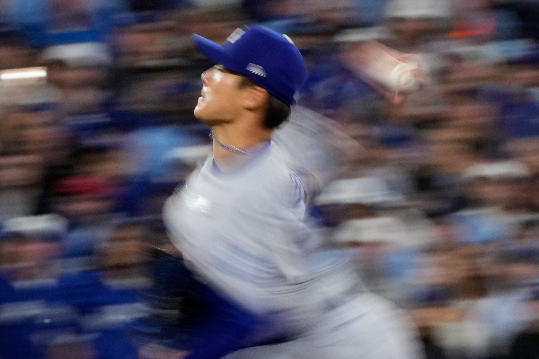 Los Angeles Dodgers pitcher Yoshinobu Yamamoto throws against the Toronto Blue Jays during the second inning in Game 2 of baseball's World Series, Saturday, Oct. 25, 2025, in Toronto. 