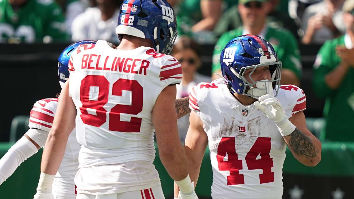 New York Giants running back Cam Skattebo celebrates a touchdown with teammates during the first half of an NFL football game against the New York Giants on Sunday, Oct. 26, 2025, in Philadelphia.