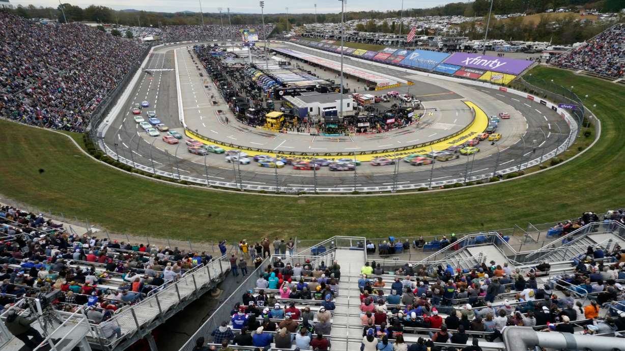 Drivers race between Turns 1 and 2 during a NASCAR Cup series auto race in Martinsville, Va., Sunday, Oct. 26, 2025.